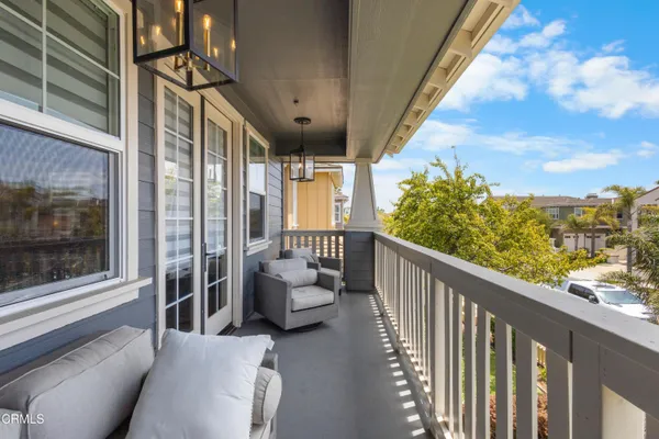 a view of backyard of house with outdoor seating