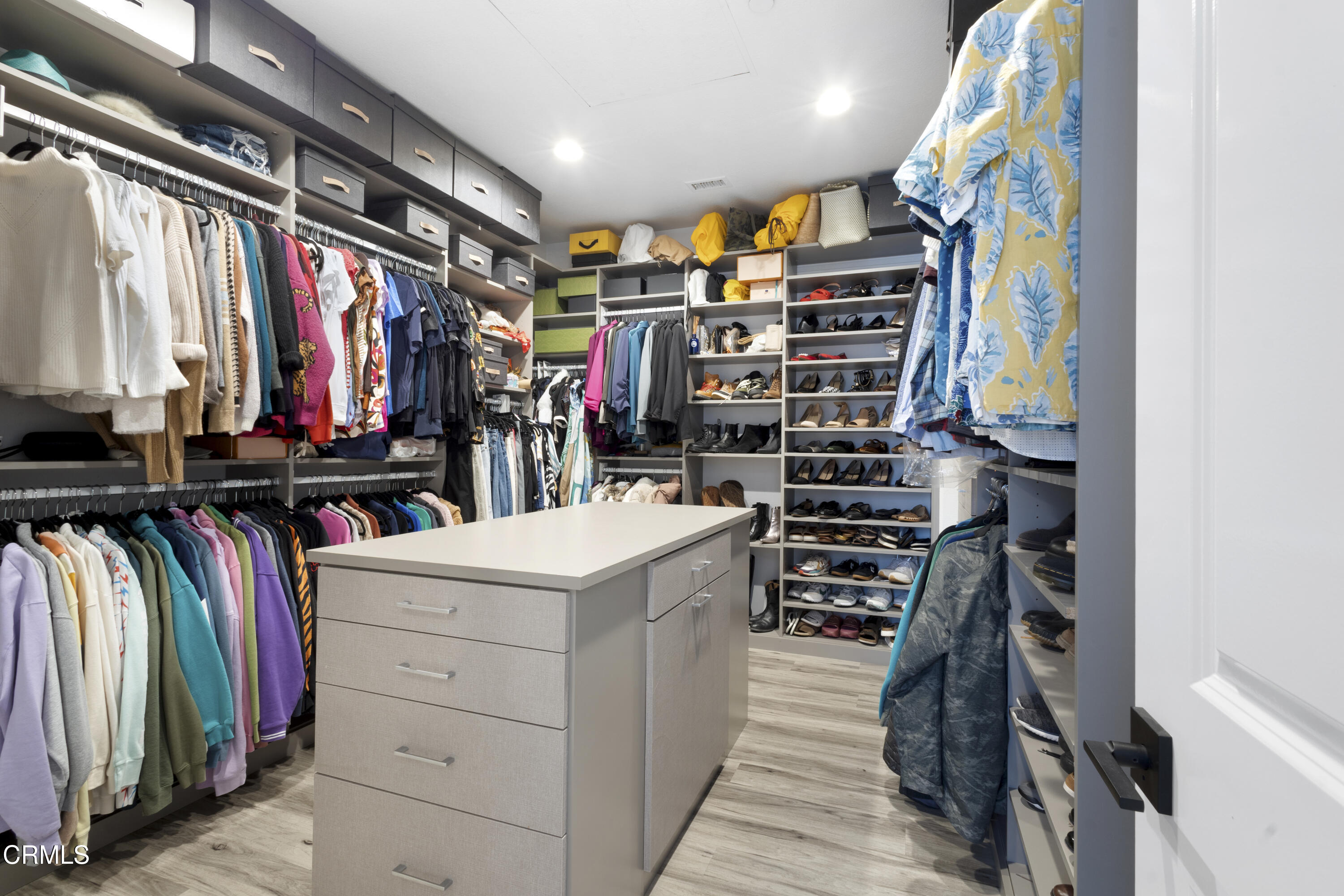 4173 Caribbean Street Oxnard, CA 93035 - Photo 40 of 64 a view of walk in closet with clothes and shoes