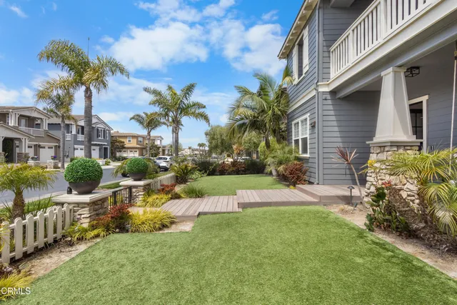 an aerial view of a swimming pool a yard and mountain