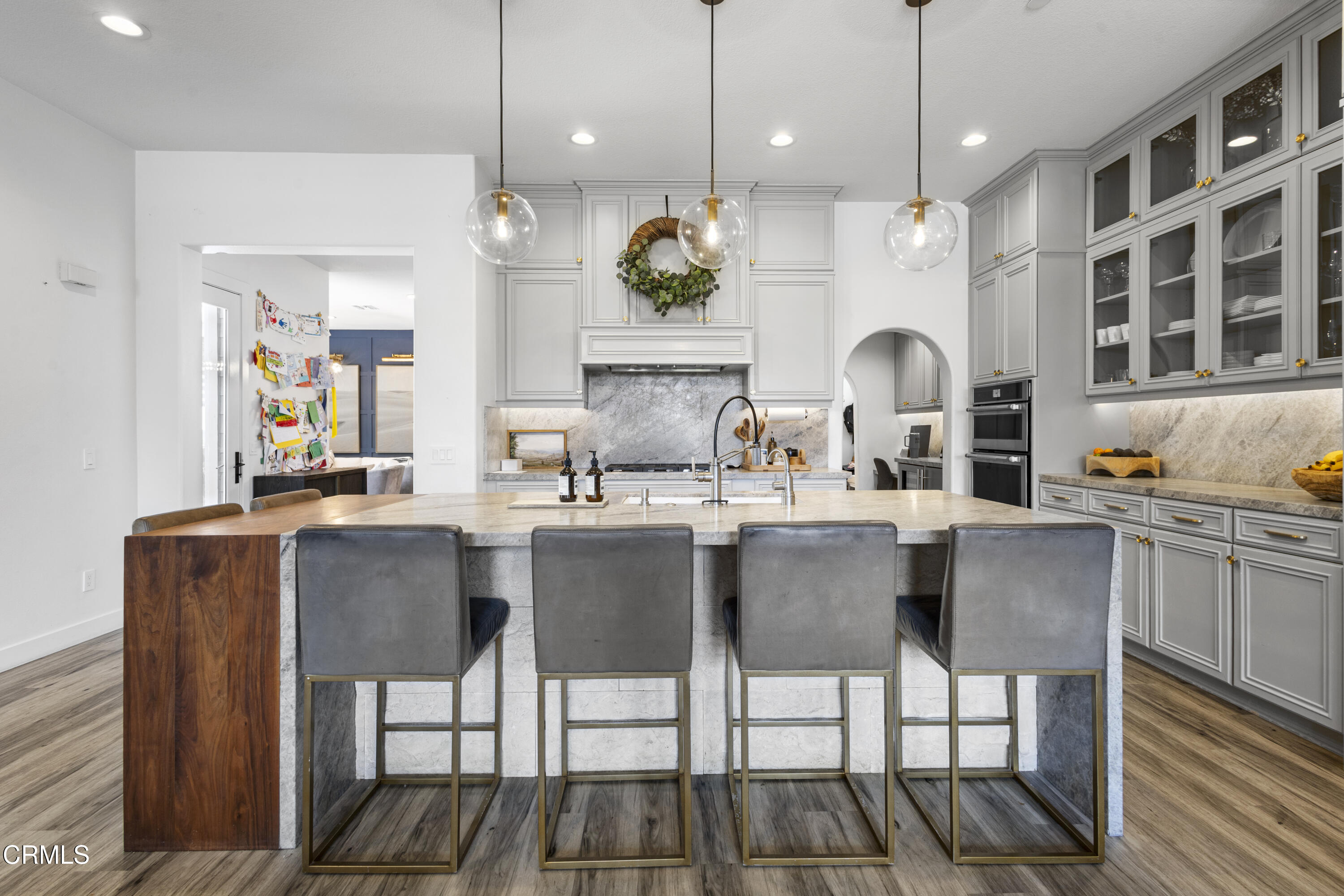 4173 Caribbean Street Oxnard, CA 93035 - Photo 7 of 64 a dining hall with stainless steel appliances kitchen island granite countertop a dining table chairs and sink