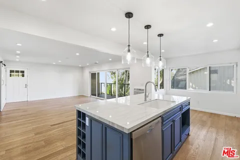 a kitchen with a stove and a sink