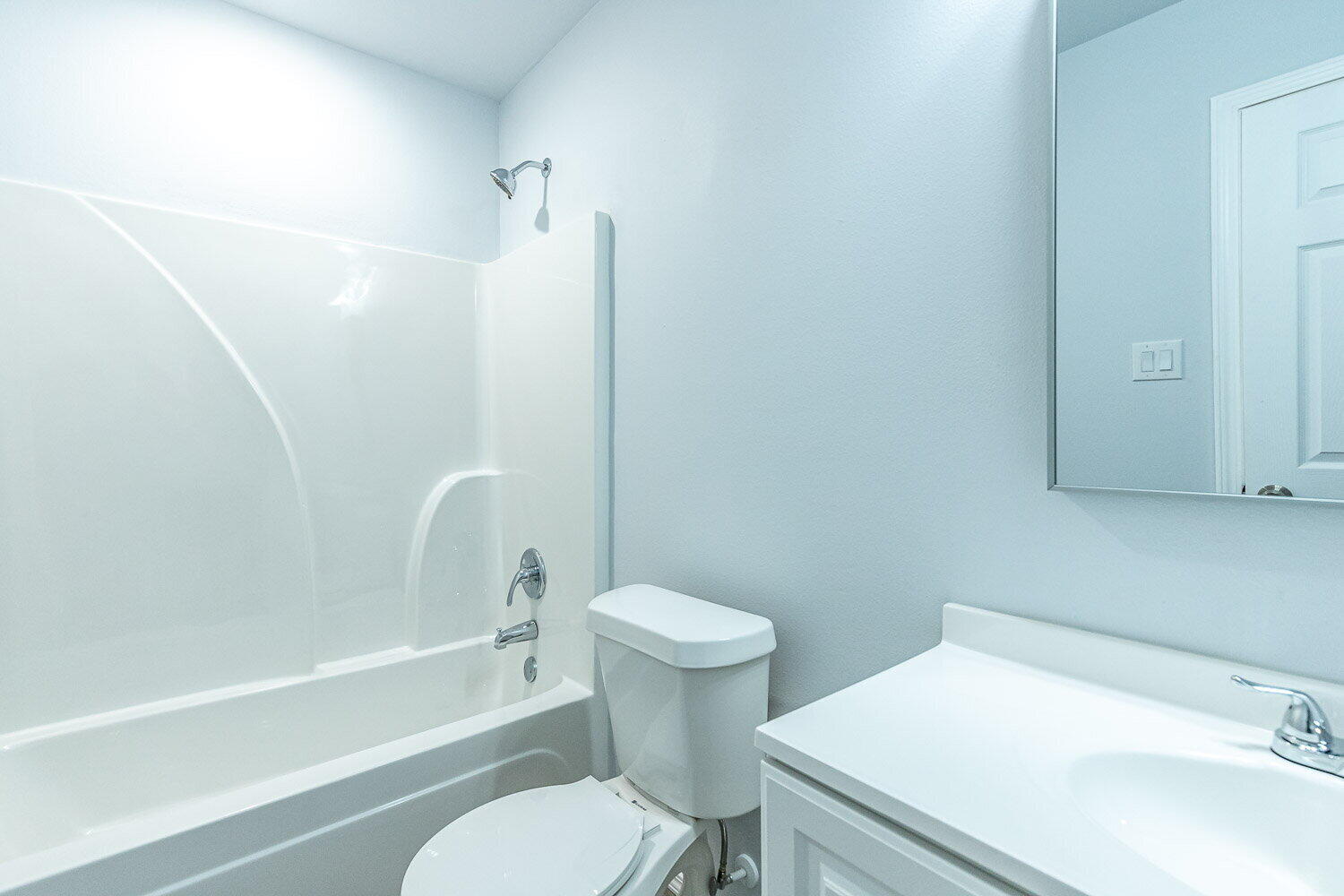 5517 Kemper Street, Unit A Lubbock, TX 79416 - Photo 17 of 25 a bathroom with a sink a toilet and a bathtub
