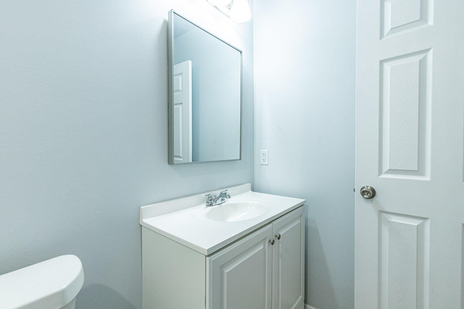 5517 Kemper Street, Unit A Lubbock, TX 79416 - Photo 18 of 25 a bathroom with a sink and a toilet