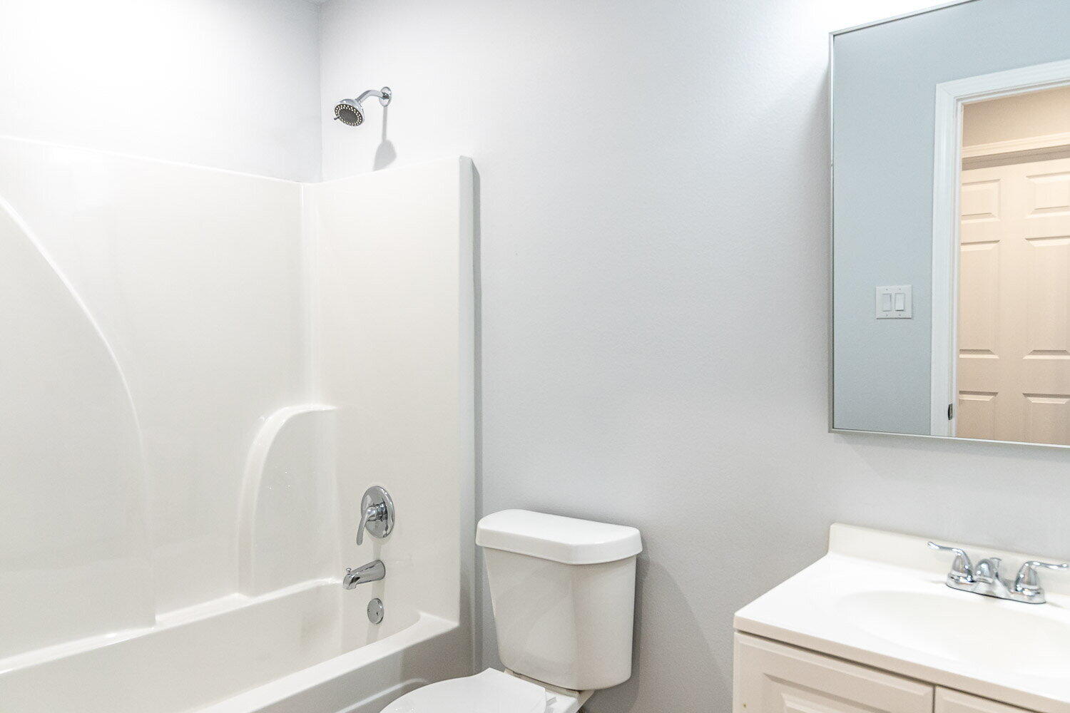 5517 Kemper Street, Unit A Lubbock, TX 79416 - Photo 21 of 25 a bathroom with a toilet and a bathtub