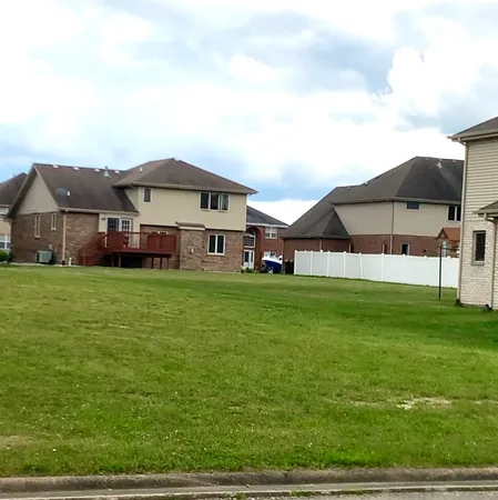 a view of a house with a big yard