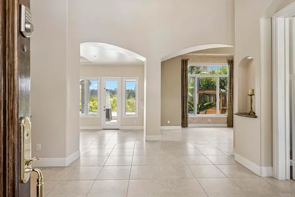 a large kitchen with kitchen island granite countertop a large counter top and sink