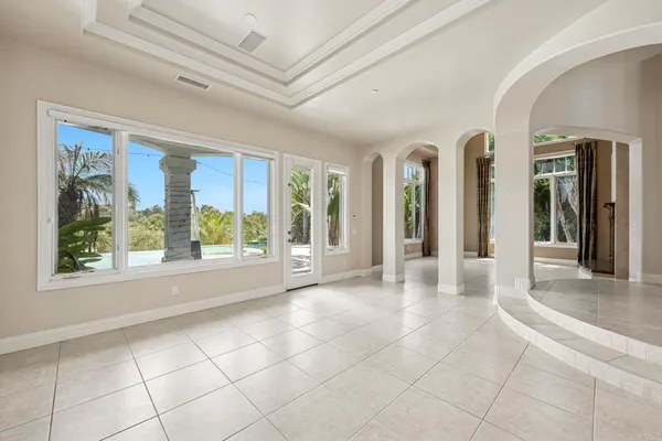 a dining room with furniture and windows