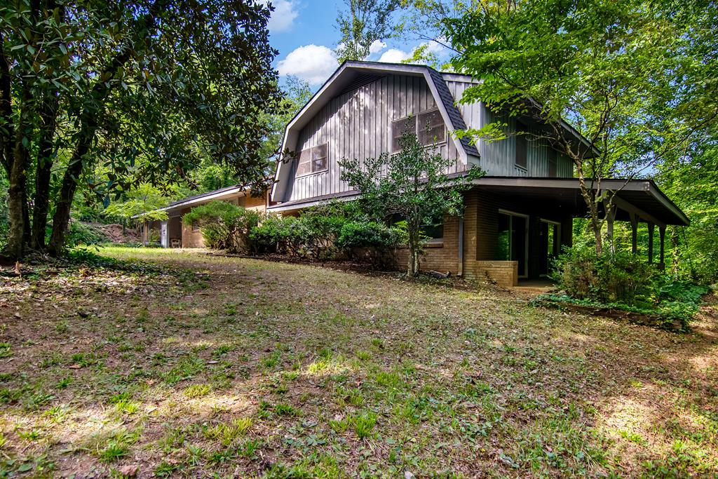 2063 Canton Road Nelson, GA 30143 - Photo 2 of 19 a front view of house with yard and trees around