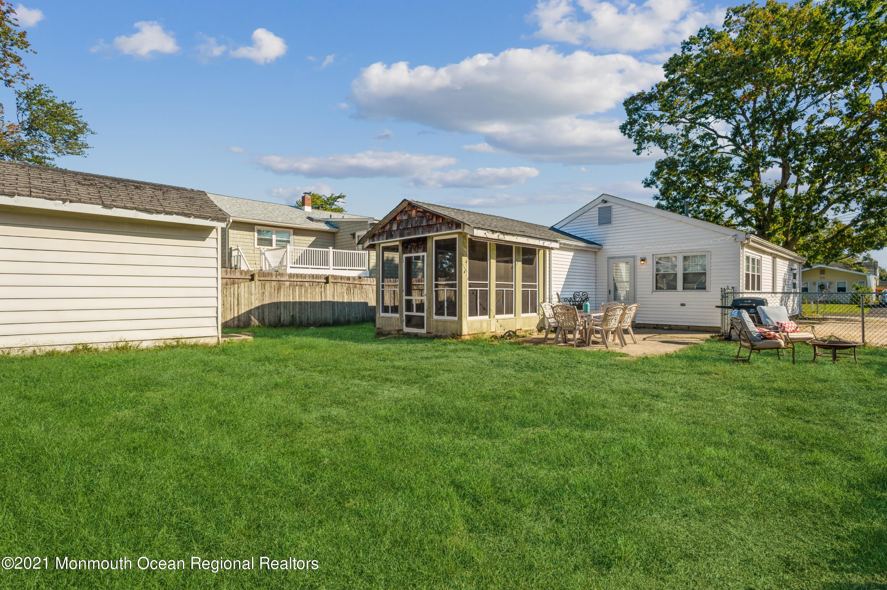 a view of a house with a backyard