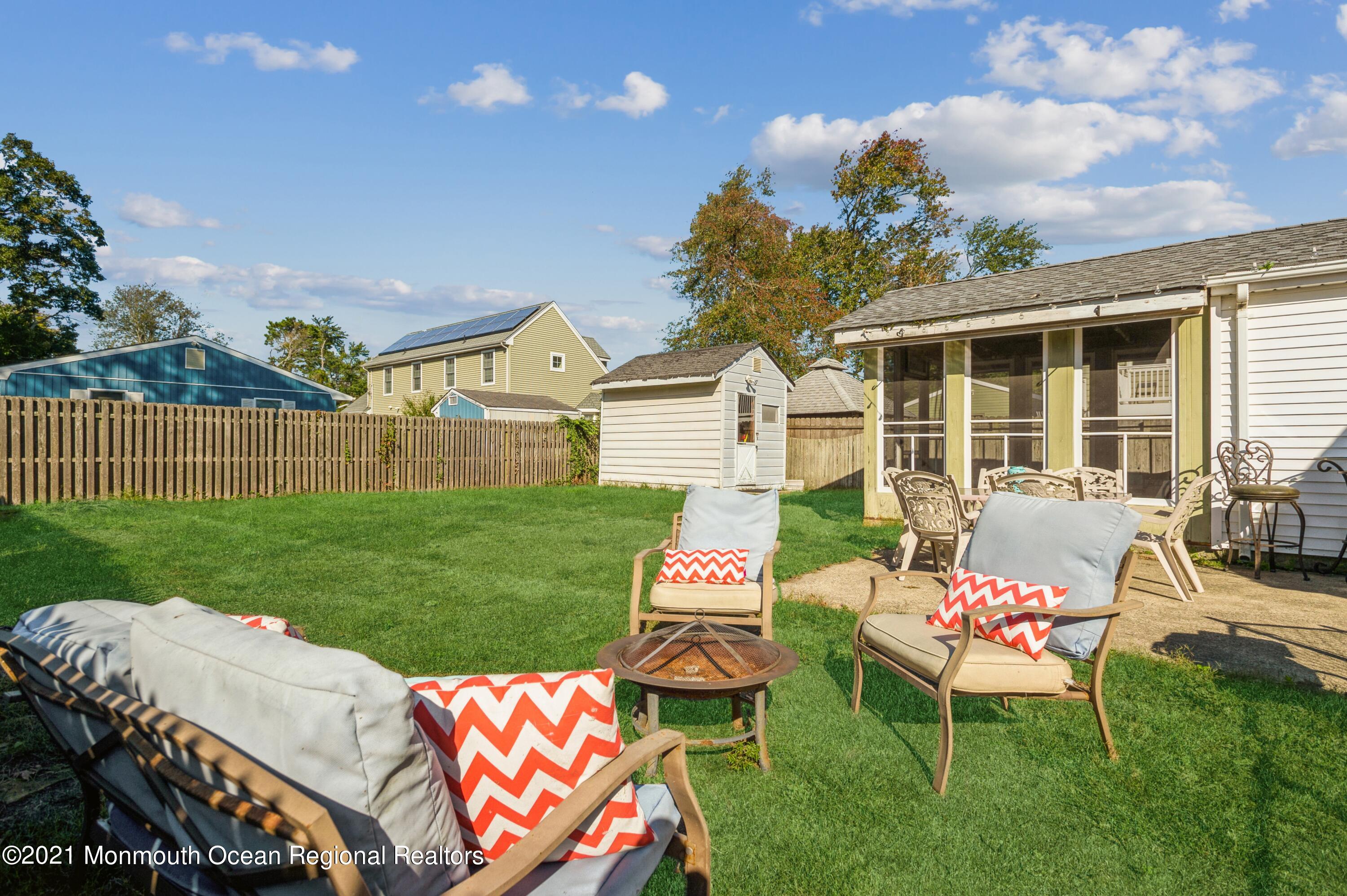 542 Lloyd Road Toms River, NJ 08753 - Photo 19 of 20 a front view of a house with backyard and sitting area