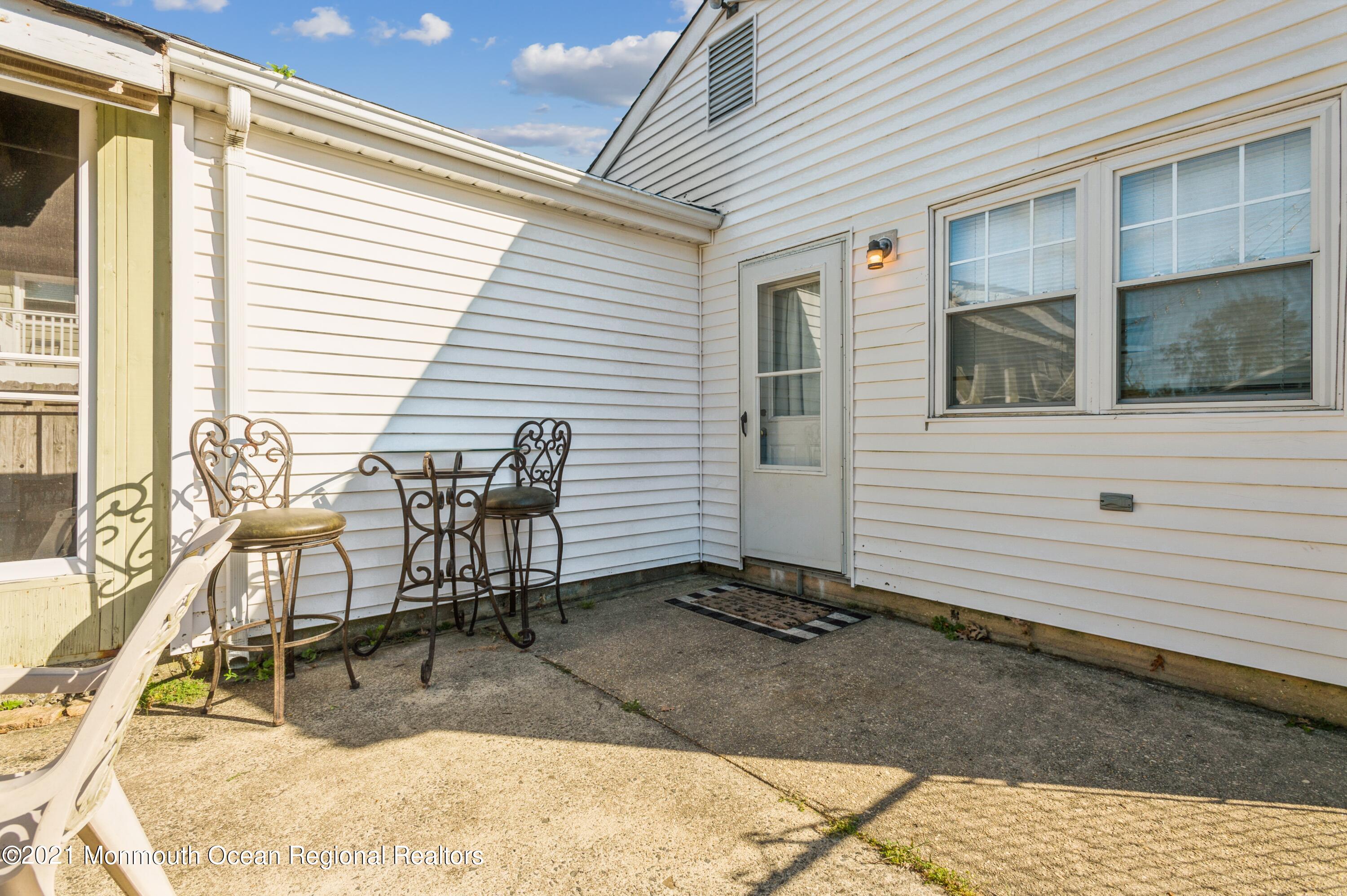542 Lloyd Road Toms River, NJ 08753 - Photo 20 of 20 a view of a dinning tables and chairs in the porch