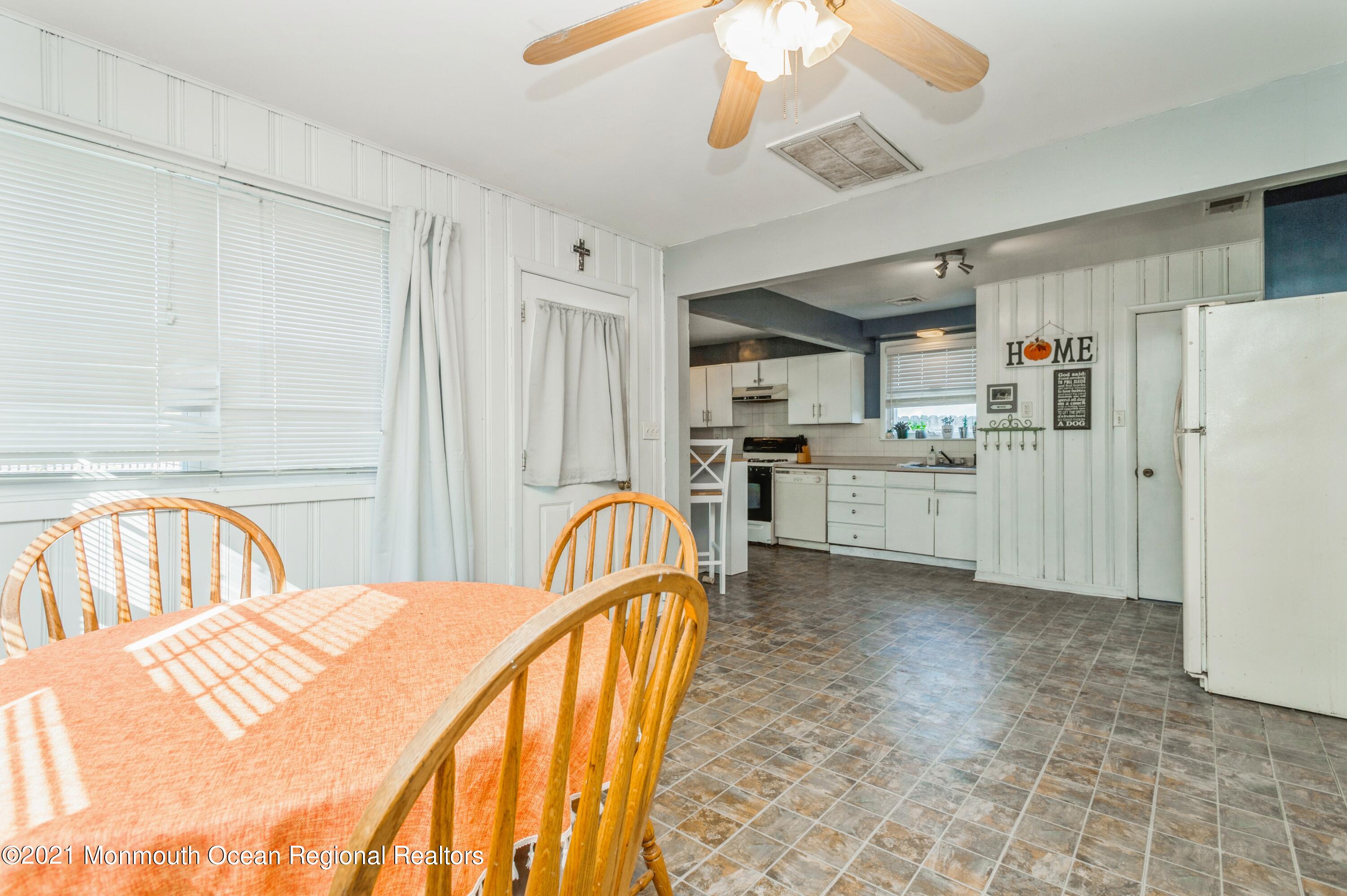 542 Lloyd Road Toms River, NJ 08753 - Photo 8 of 20 a view of a kitchen with furniture and stainless steel appliances