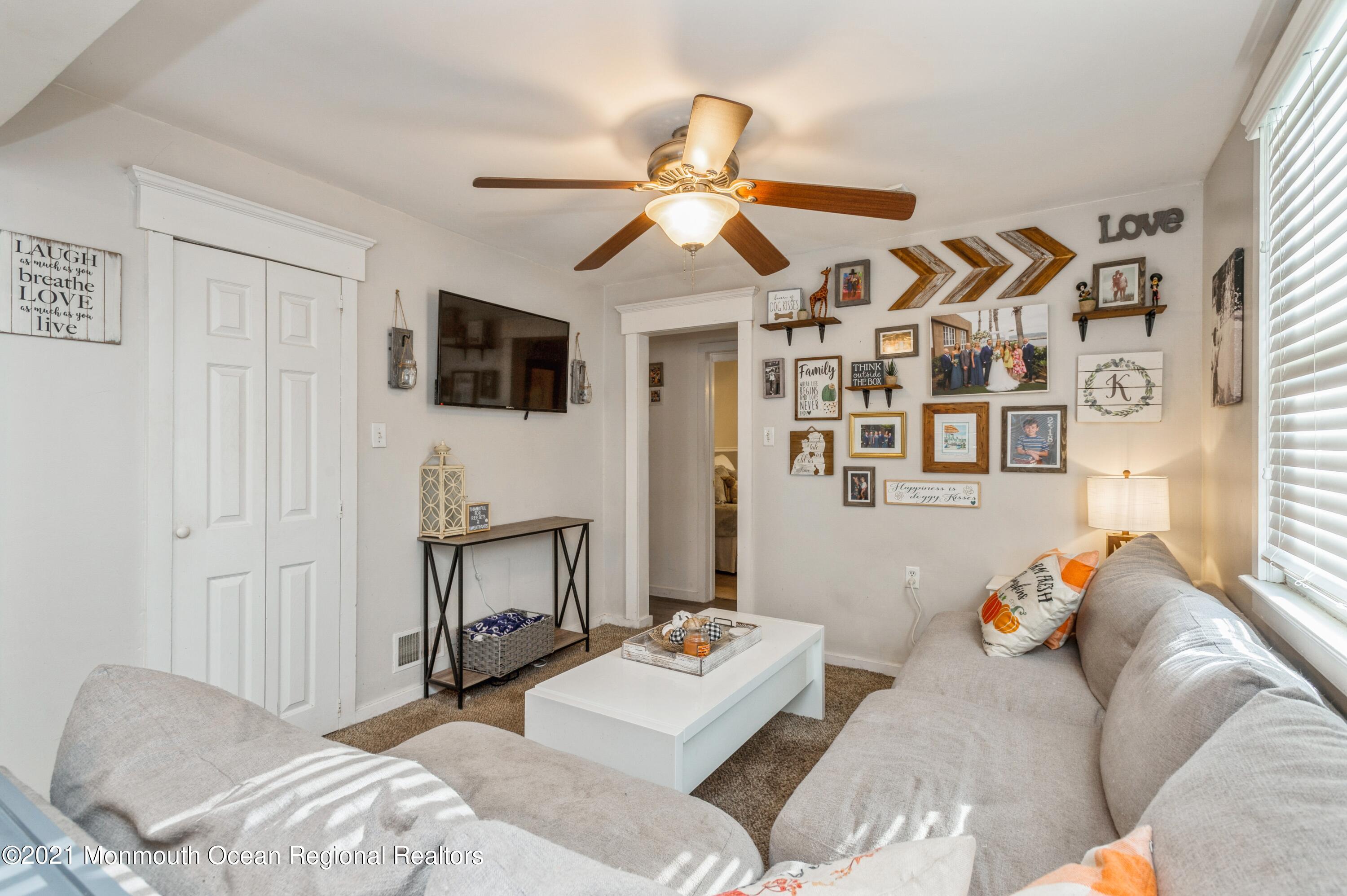 542 Lloyd Road Toms River, NJ 08753 - Photo 9 of 20 a bedroom with furniture and a flat screen tv