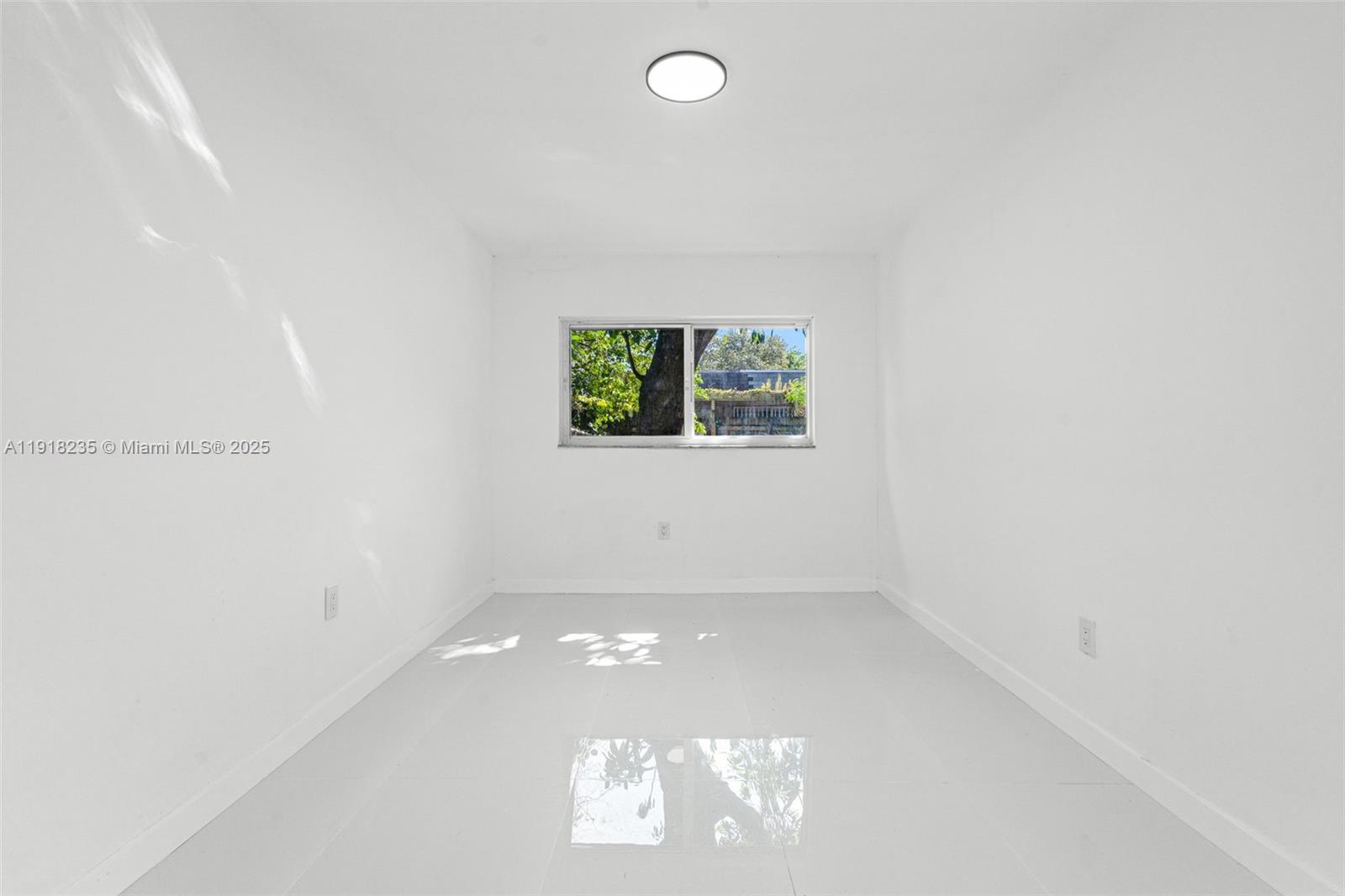 3956 Northwest 207 St Road Miami Gardens, FL 33055 - Photo 19 of 36 an empty room with a window