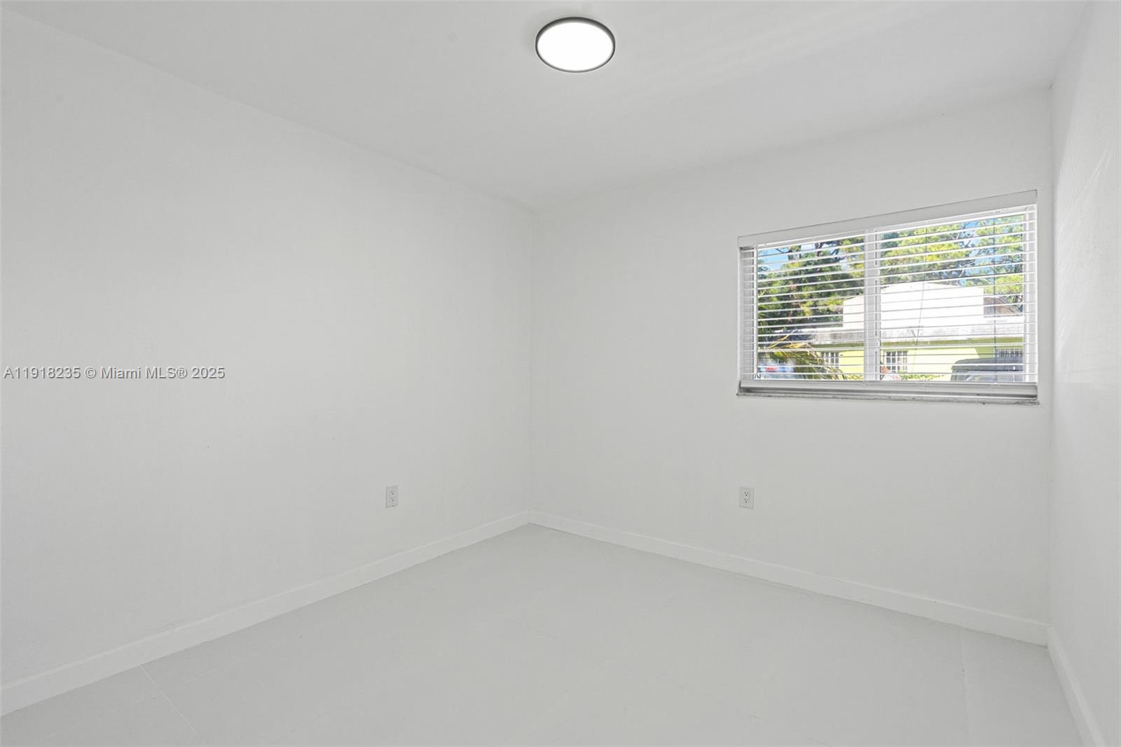 3956 Northwest 207 St Road Miami Gardens, FL 33055 - Photo 25 of 36 an empty room with a window