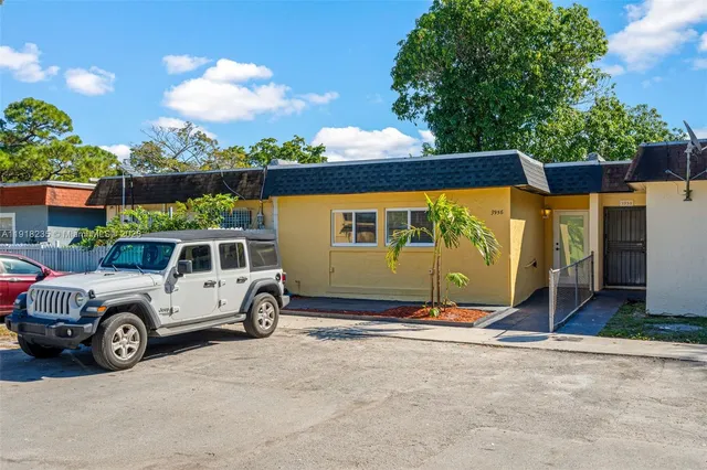 a car parked in front of a house