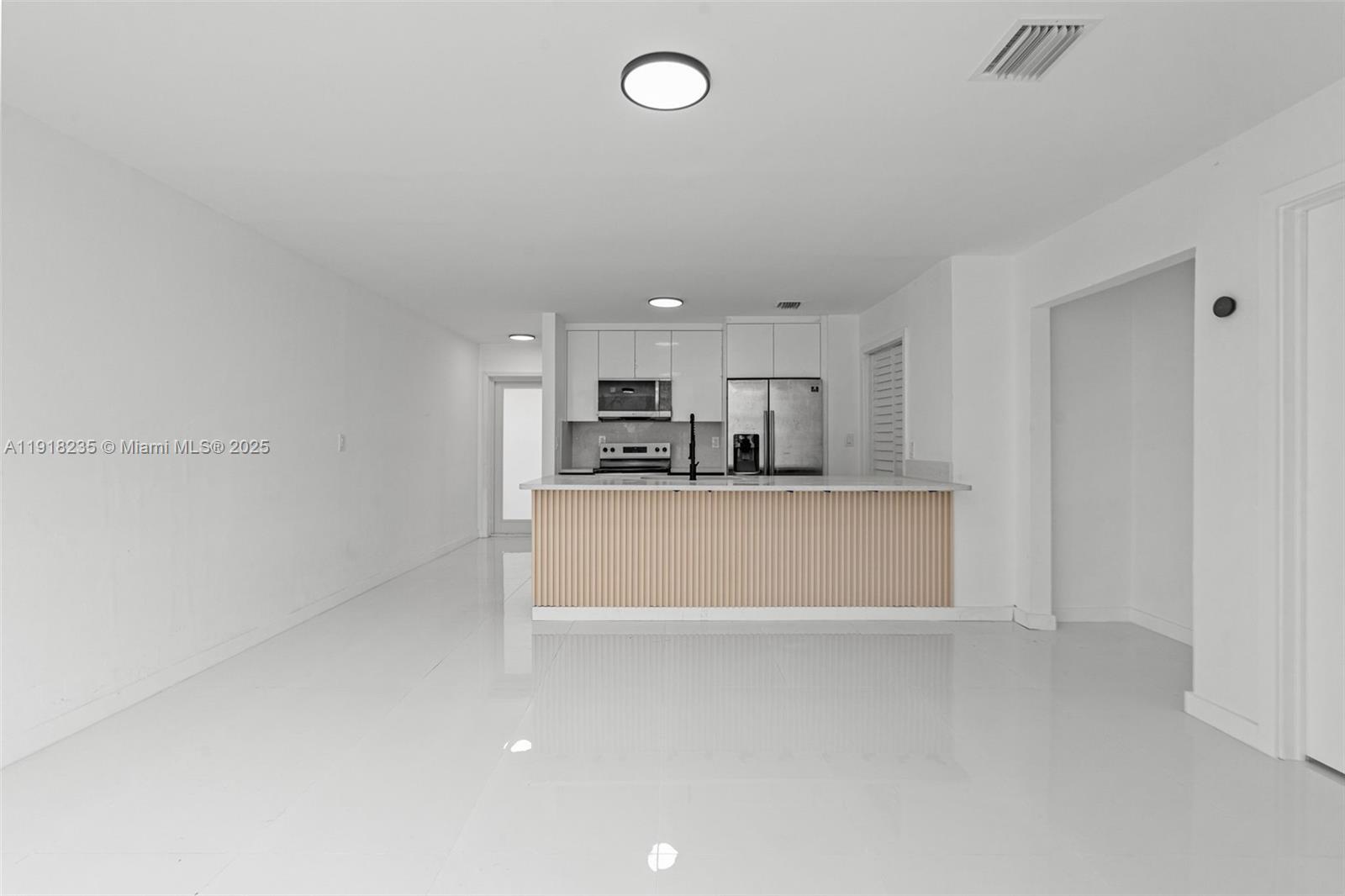 3956 Northwest 207 St Road Miami Gardens, FL 33055 - Photo 9 of 36 a view of kitchen with refrigerator sink and cabinets