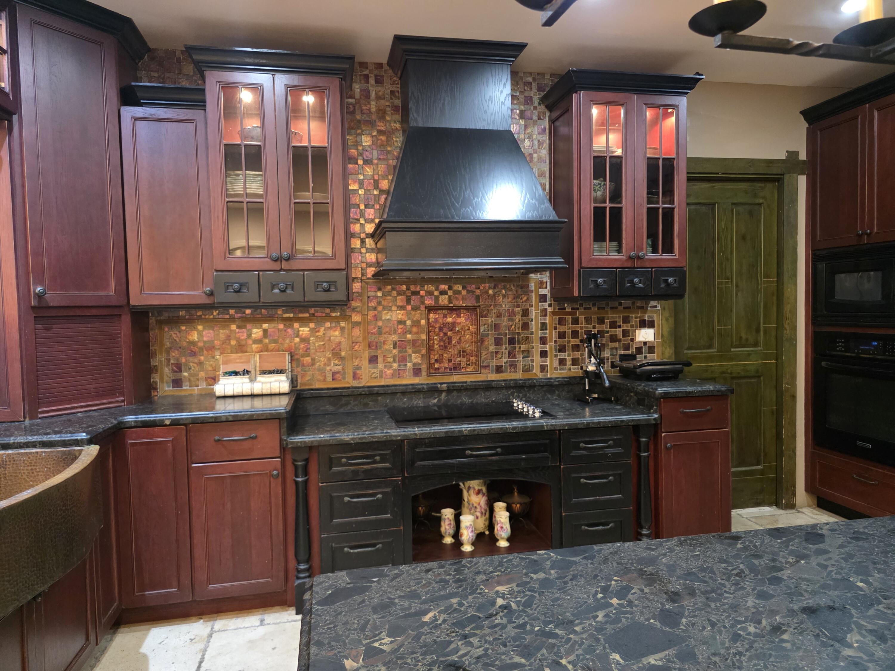 4200 North Surf Road Hollywood, FL 33019 - Photo 16 of 32 a kitchen with stainless steel appliances granite countertop a stove and a sink