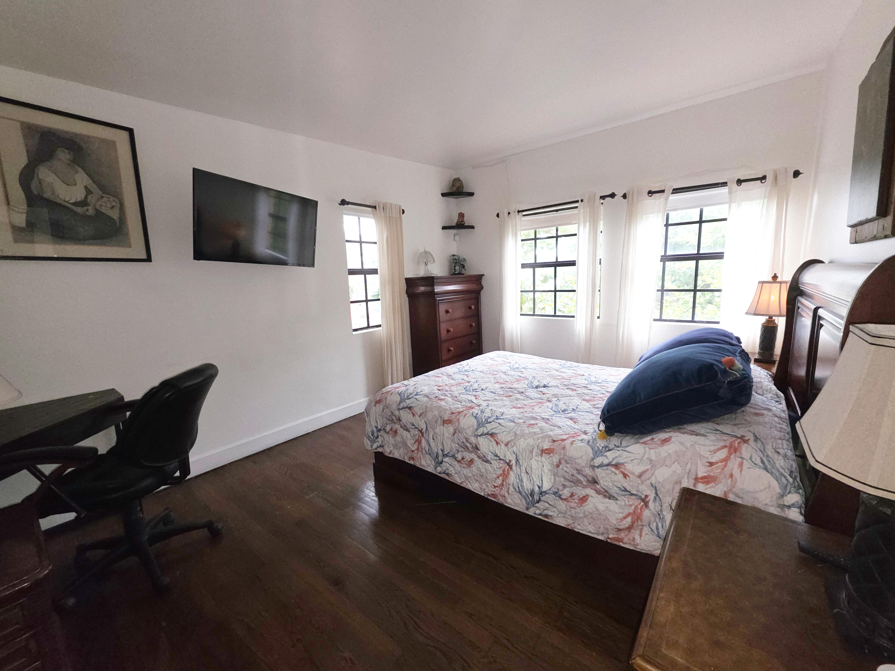 4200 North Surf Road Hollywood, FL 33019 - Photo 21 of 32 a bedroom with a bed and wooden floor