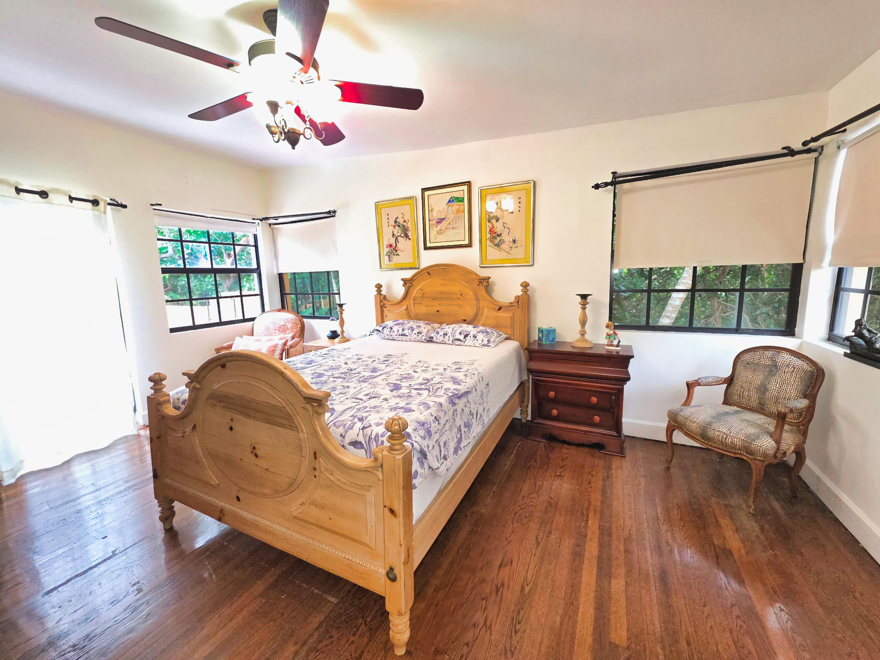 4200 North Surf Road Hollywood, FL 33019 - Photo 22 of 32 a bedroom with a bed wooden floor and windows