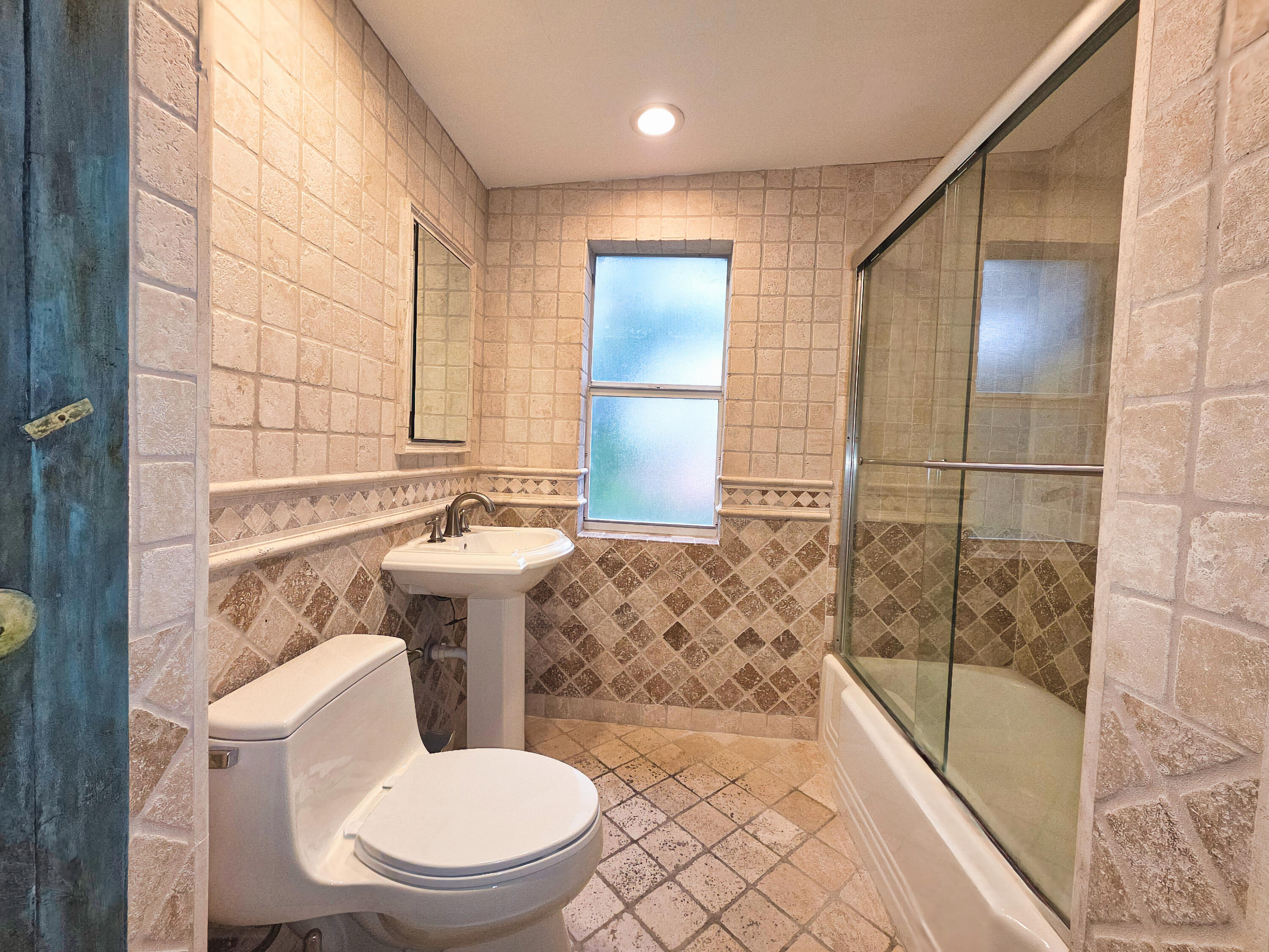 4200 North Surf Road Hollywood, FL 33019 - Photo 24 of 32 a bathroom with a toilet a sink and a bathtub