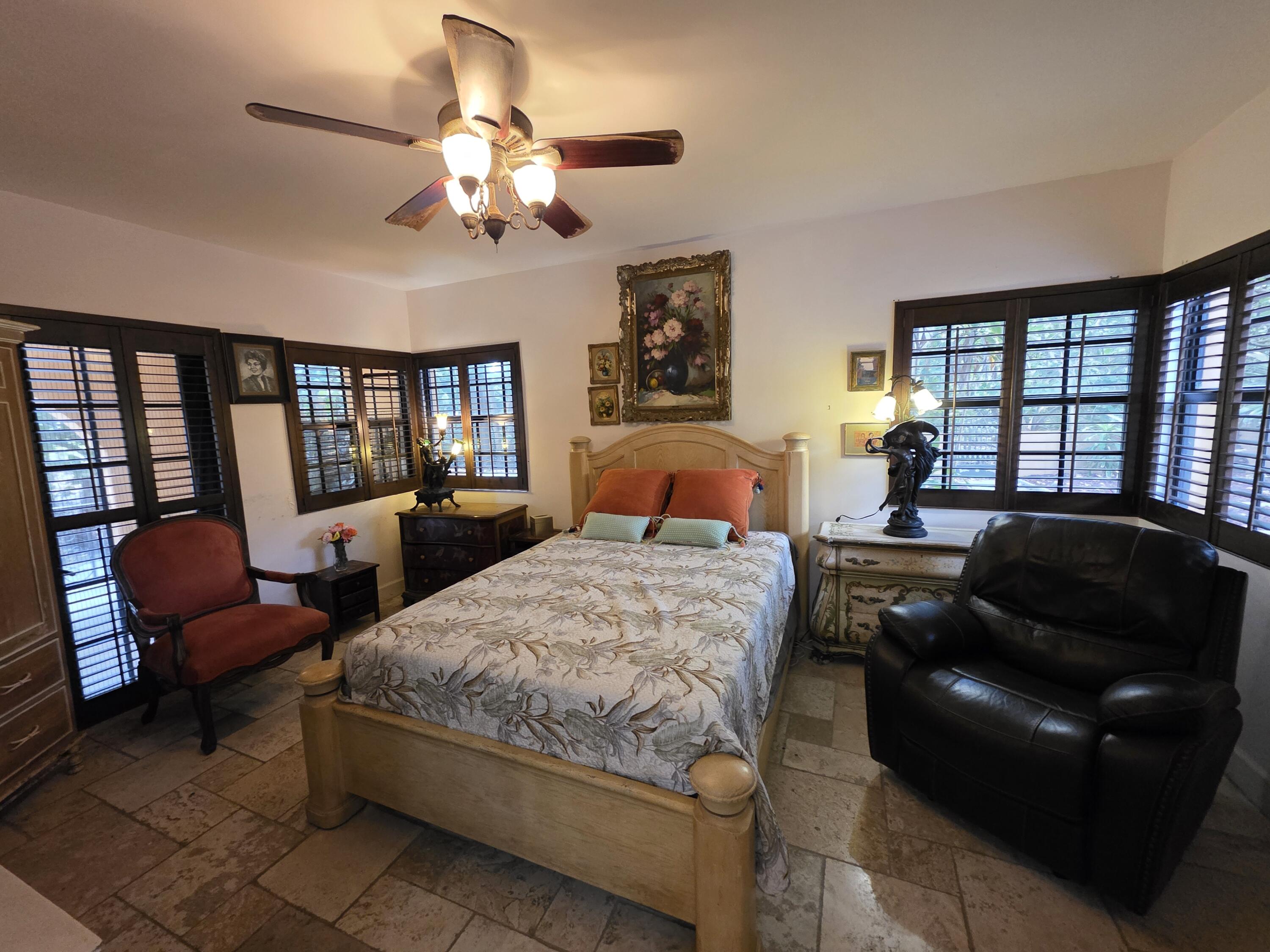 4200 North Surf Road Hollywood, FL 33019 - Photo 25 of 32 a bedroom with a bed and a couch