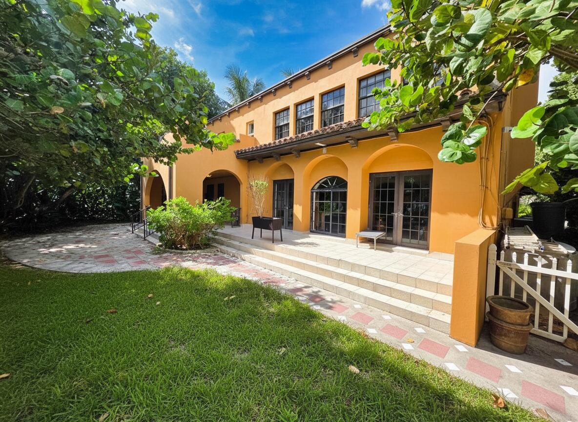 4200 North Surf Road Hollywood, FL 33019 - Photo 3 of 32 a front view of a house with a yard and garage