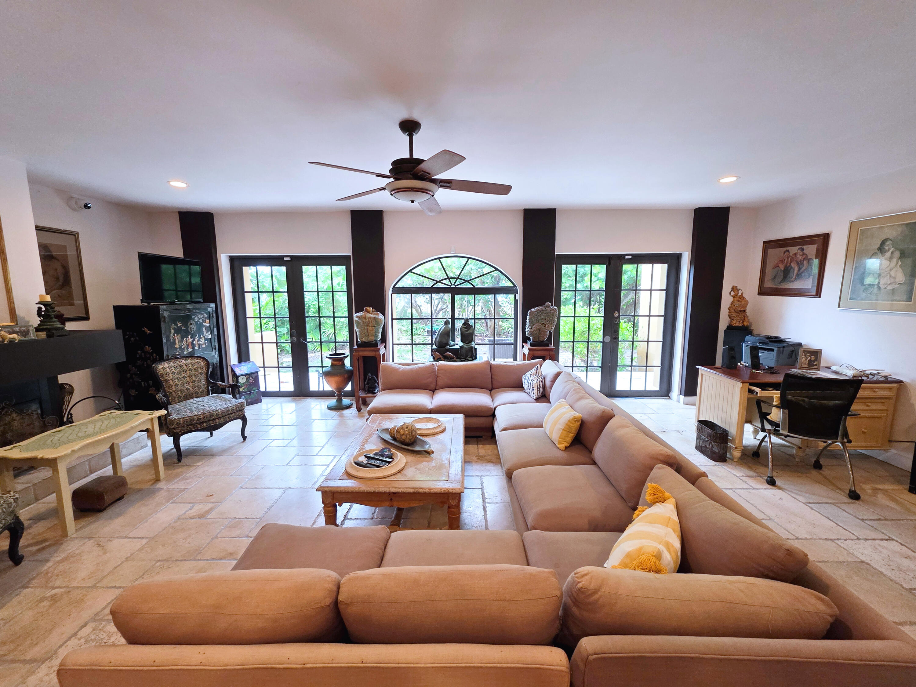 4200 North Surf Road Hollywood, FL 33019 - Photo 4 of 32 a living room with furniture ceiling fan and a large window