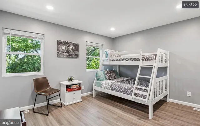 a bedroom with a bed and a desk