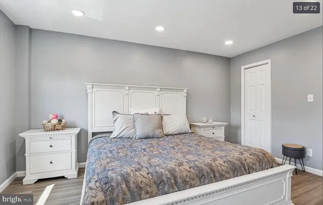 a bedroom with a bed and a dresser