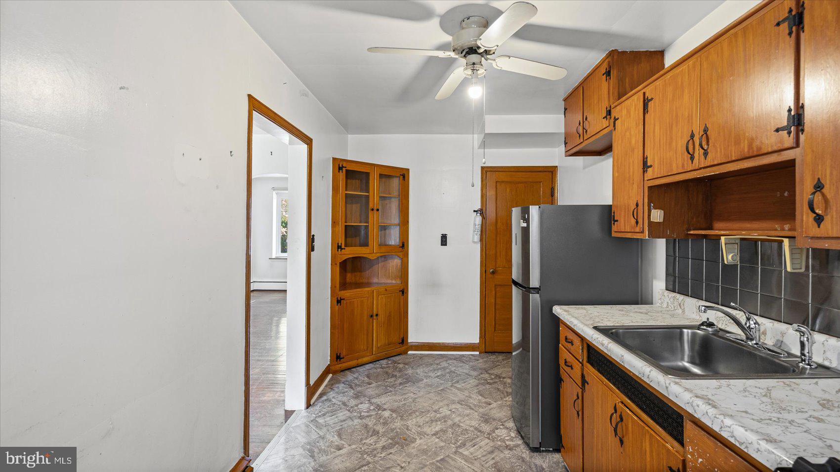 1805 Crestview Road Baltimore, MD 21239 - Photo 15 of 39 a kitchen with stainless steel appliances granite countertop a refrigerator a sink and dishwasher