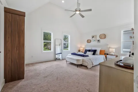 a bed room with furniture and a window