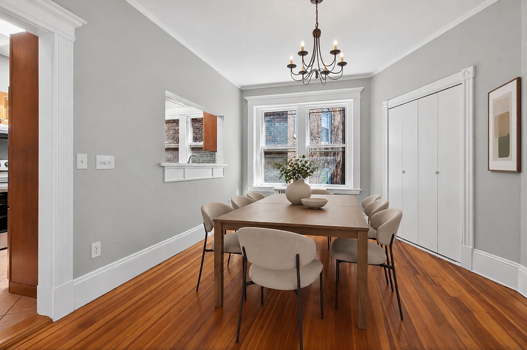 16 Garrison Road, Unit 5 Brookline, MA 02445 - Photo 4 of 14 a view of a dining room with furniture window and wooden floor