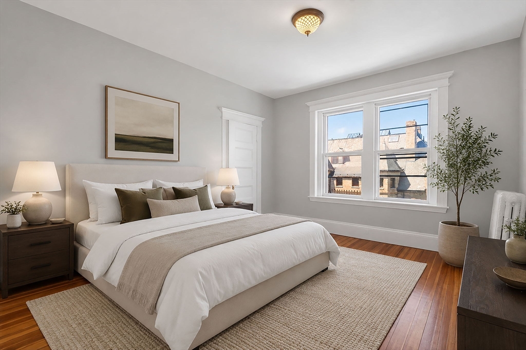 16 Garrison Road, Unit 5 Brookline, MA 02445 - Photo 8 of 14 a bedroom with bed and a large window