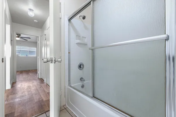 a bathroom with a bathtub and a shower
