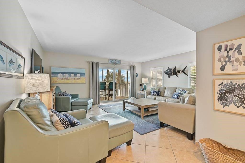 6154 Midnight Pass Road, Unit 206 Sarasota, FL 34242 - Photo 3 of 9 a living room with furniture and a large window