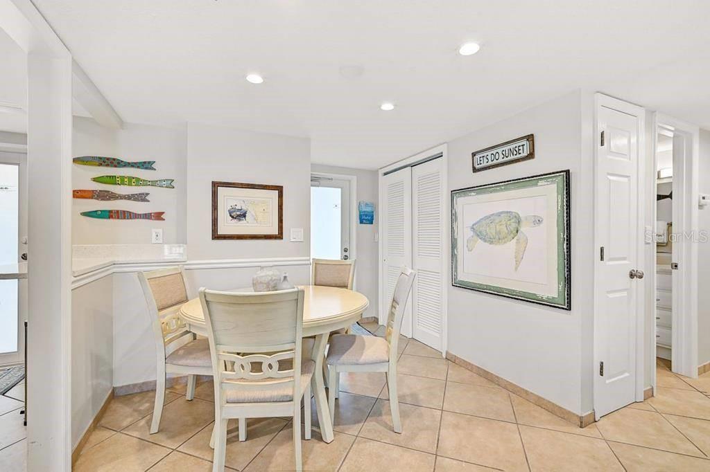 6154 Midnight Pass Road, Unit 206 Sarasota, FL 34242 - Photo 4 of 9 a view of a dining room with furniture