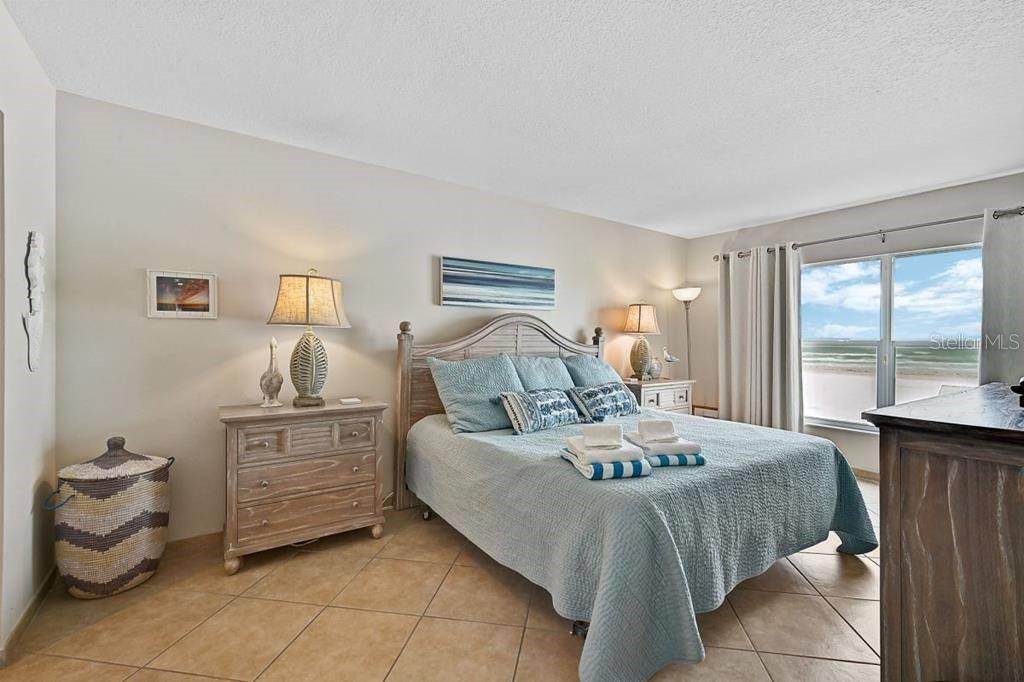 6154 Midnight Pass Road, Unit 206 Sarasota, FL 34242 - Photo 8 of 9 a bedroom with a bed and window