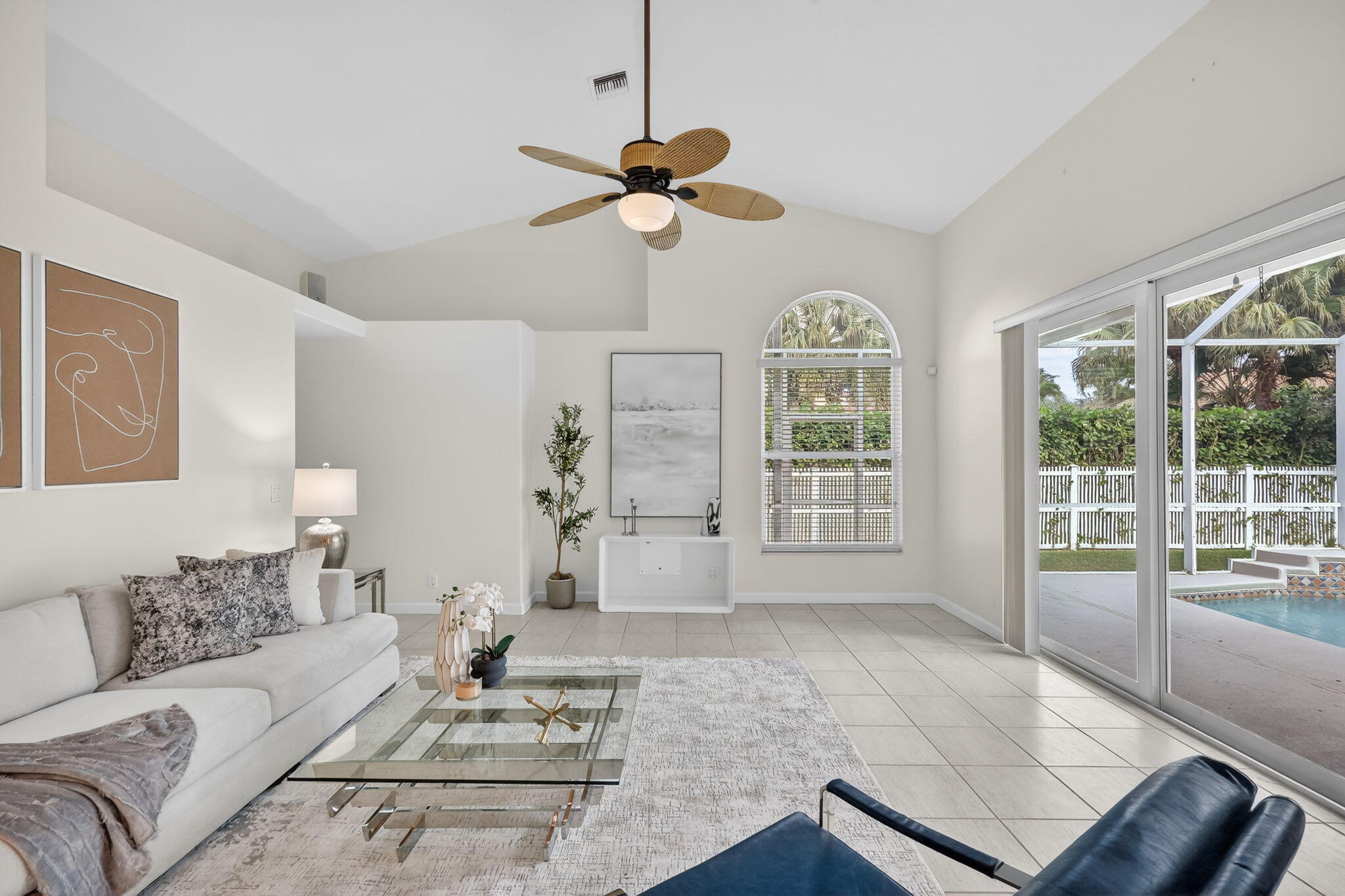 18981 Southeast Outrigger Lane Jupiter, FL 33458 - Photo 25 of 79 a living room with furniture a window and a chandelier