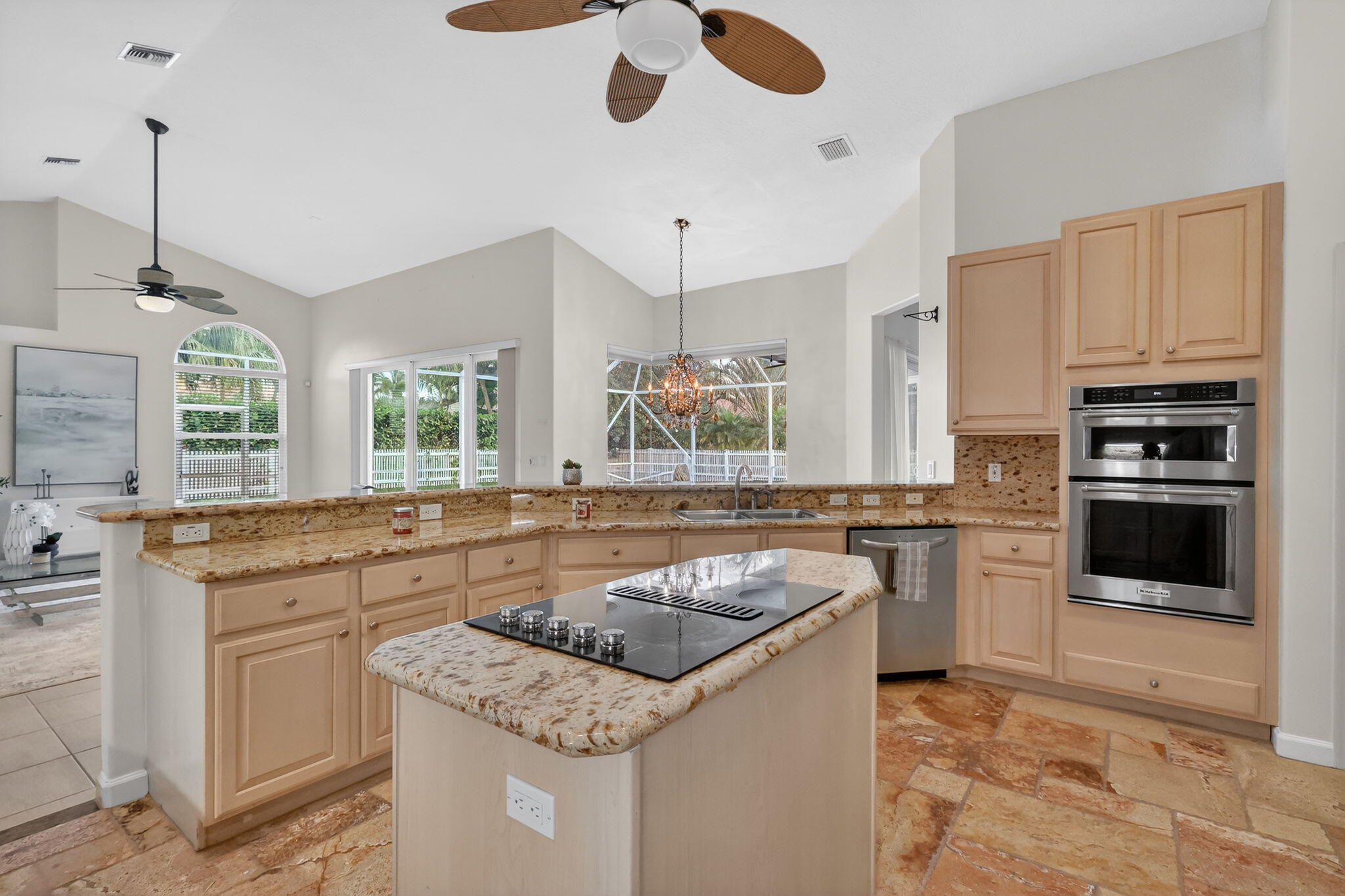 18981 Southeast Outrigger Lane Jupiter, FL 33458 - Photo 31 of 79 a kitchen with stainless steel appliances granite countertop a sink stove and refrigerator