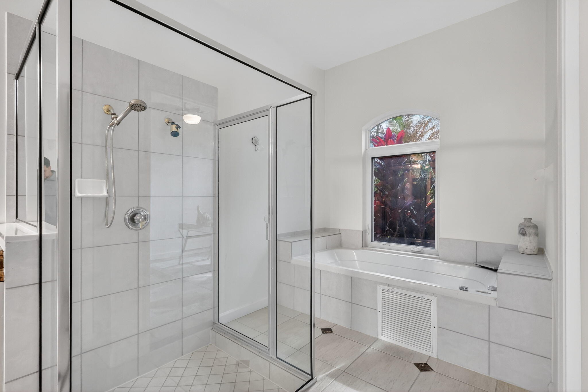 18981 Southeast Outrigger Lane Jupiter, FL 33458 - Photo 41 of 79 a bathroom with a shower sink and mirror