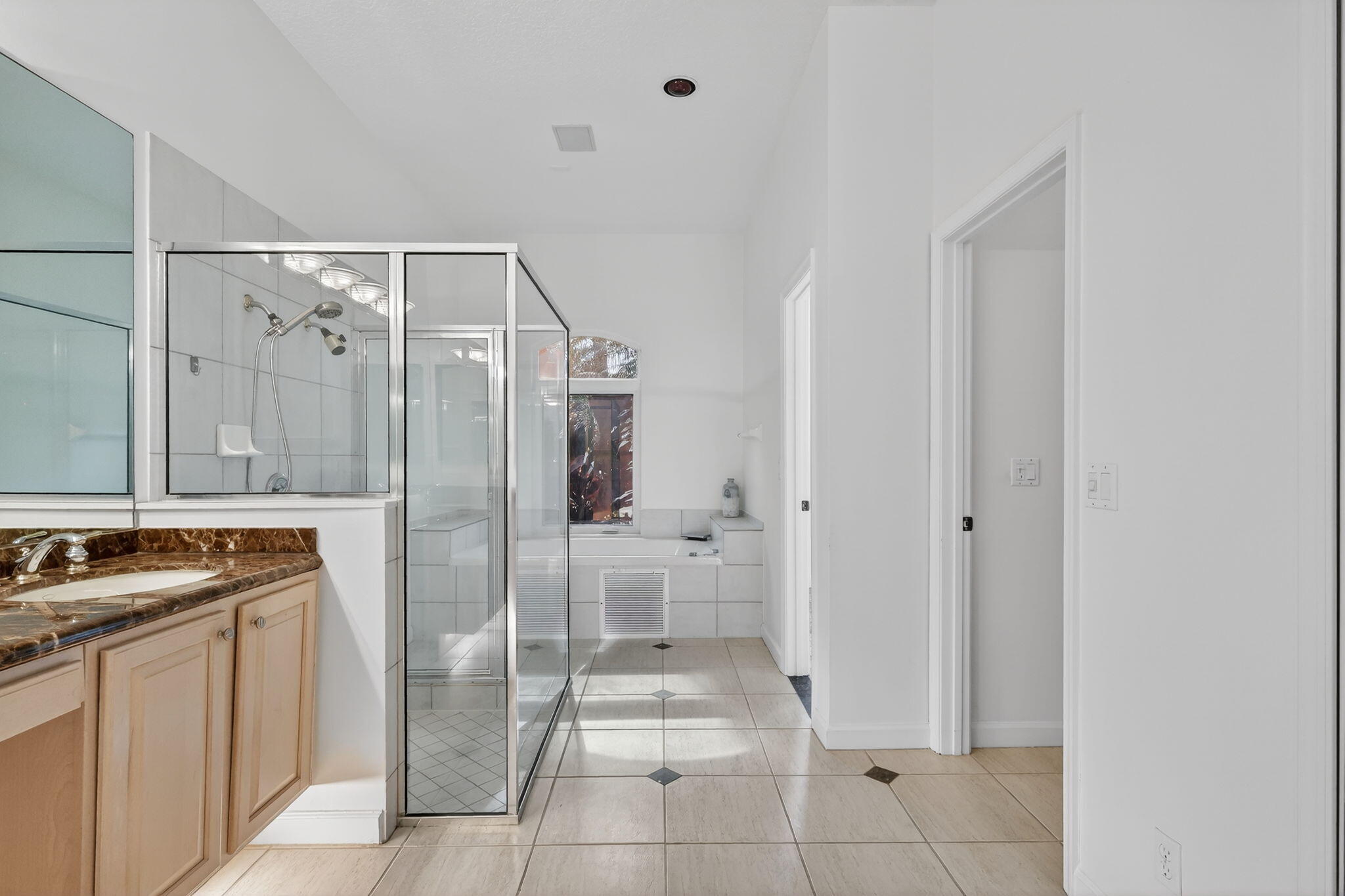 18981 Southeast Outrigger Lane Jupiter, FL 33458 - Photo 42 of 79 a bathroom with a granite countertop sink a toilet and shower