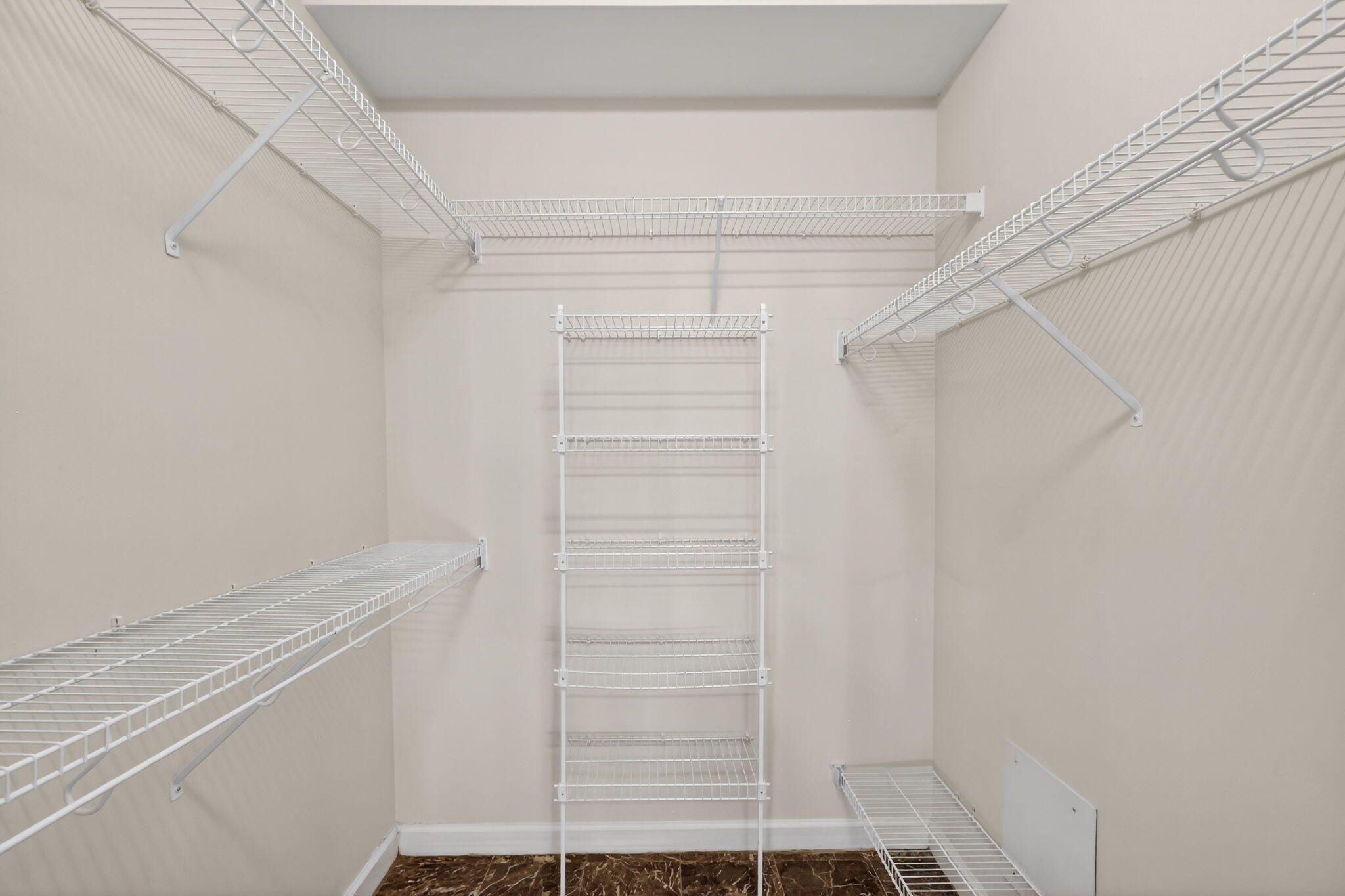 18981 Southeast Outrigger Lane Jupiter, FL 33458 - Photo 45 of 79 a view of walk in closet with empty racks