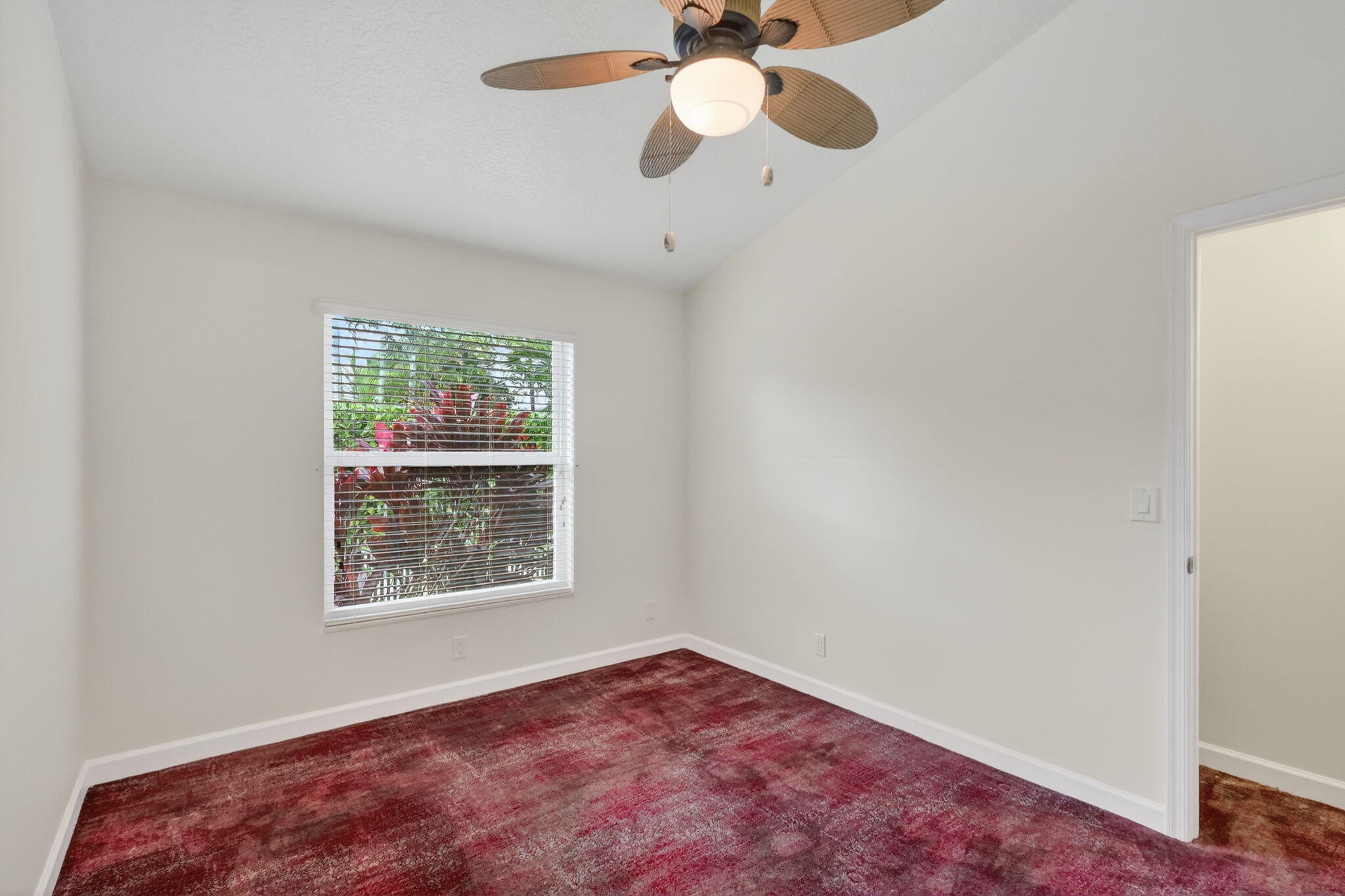 18981 Southeast Outrigger Lane Jupiter, FL 33458 - Photo 47 of 79 an empty room with a window and a fan