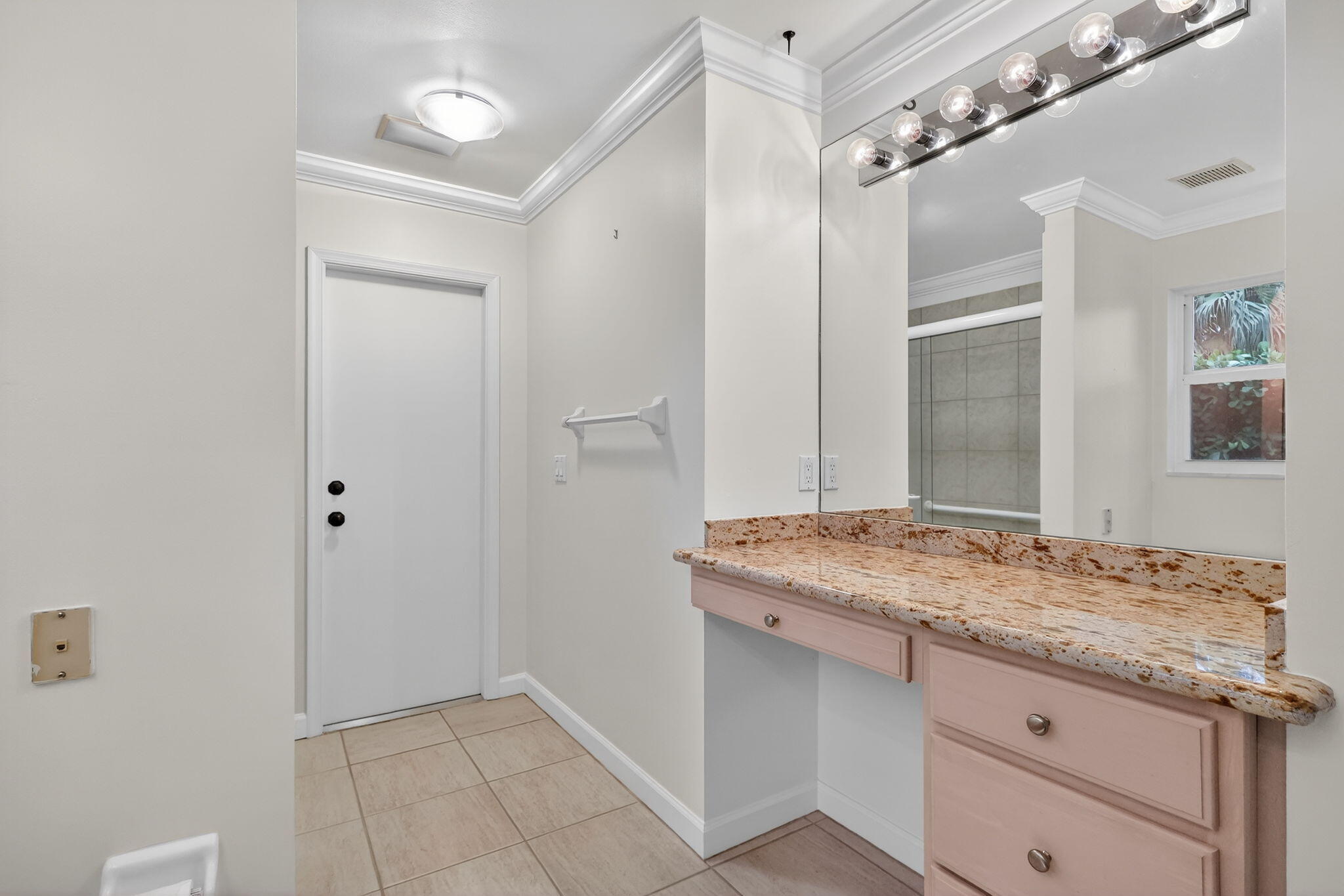 18981 Southeast Outrigger Lane Jupiter, FL 33458 - Photo 56 of 79 a bathroom with a granite countertop sink and a mirror