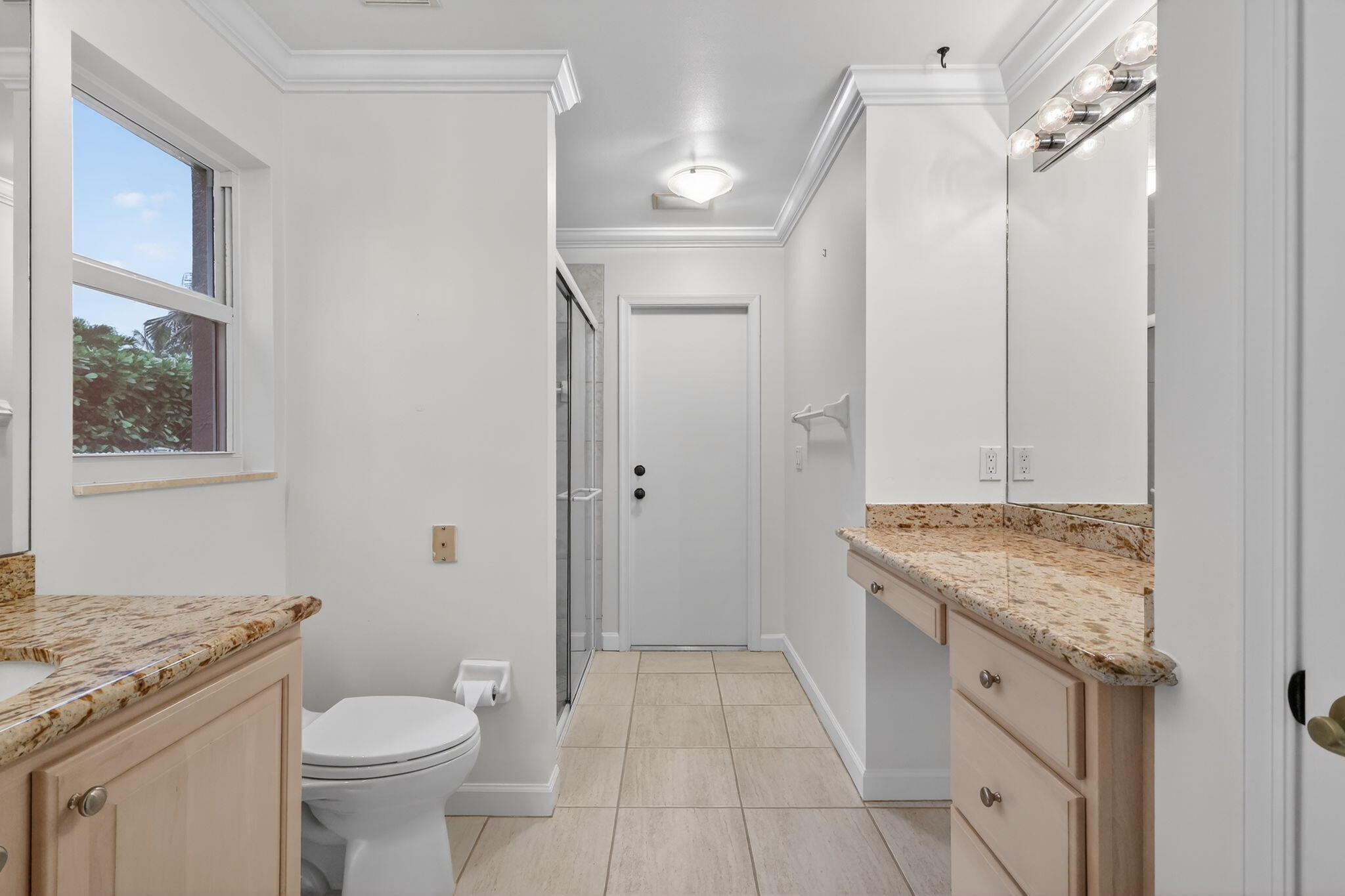 18981 Southeast Outrigger Lane Jupiter, FL 33458 - Photo 58 of 79 a spacious bathroom with a granite countertop sink toilet and shower