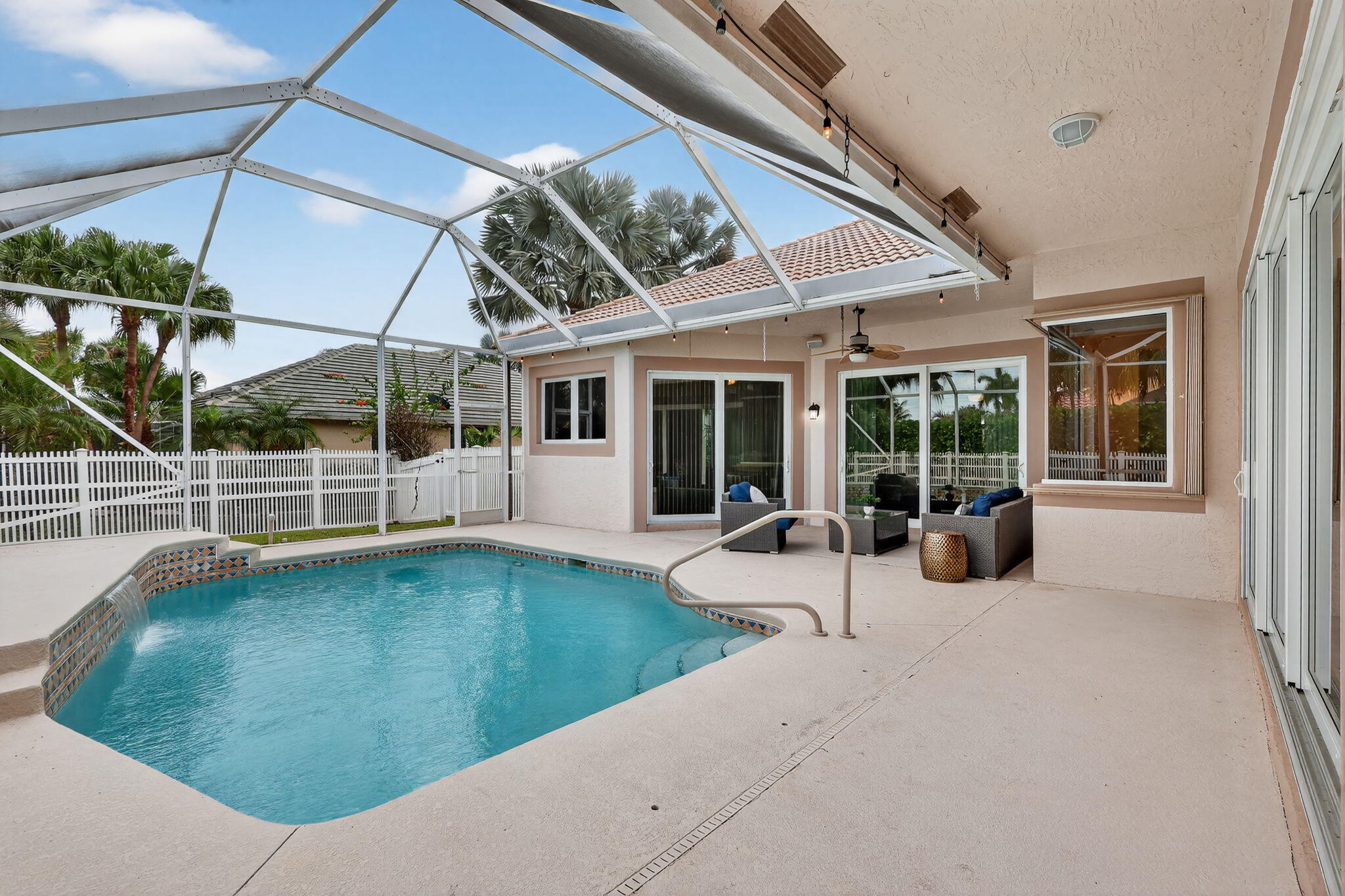 18981 Southeast Outrigger Lane Jupiter, FL 33458 - Photo 62 of 79 a view of a house with backyard porch and sitting area