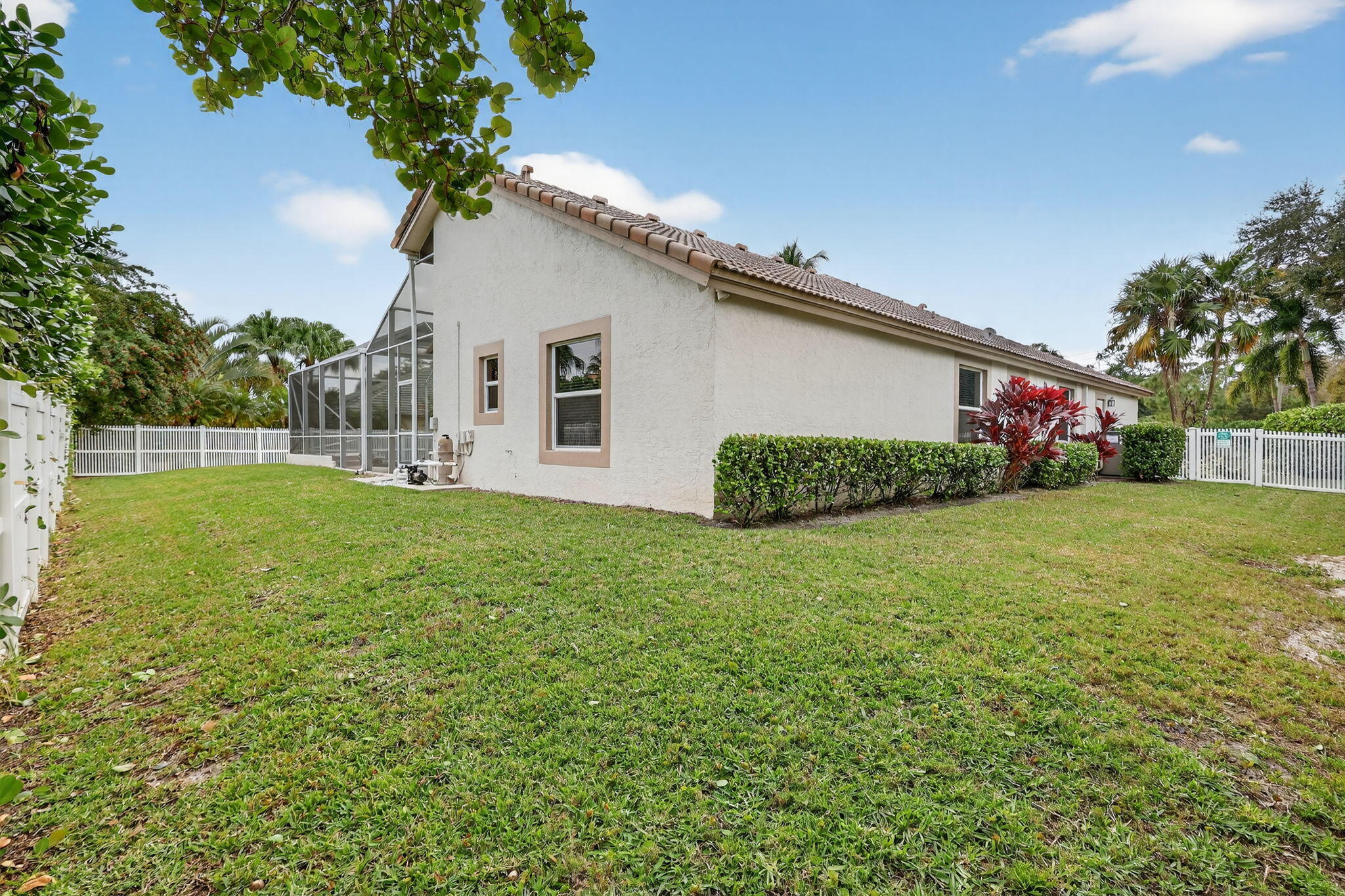 18981 Southeast Outrigger Lane Jupiter, FL 33458 - Photo 67 of 79 a white house that has a tree in front of it