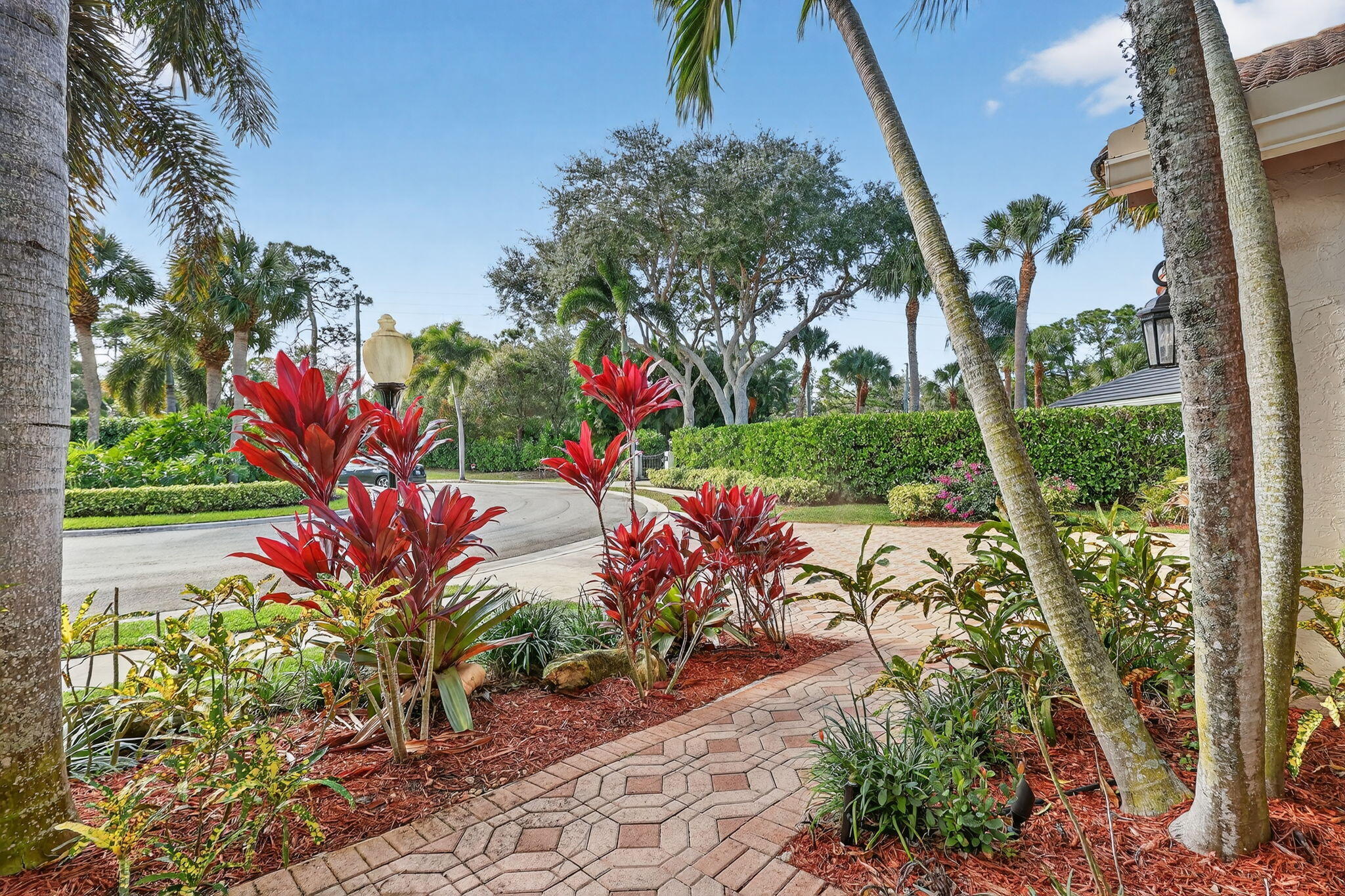 18981 Southeast Outrigger Lane Jupiter, FL 33458 - Photo 7 of 79 a front view of a house with a yard and fountain