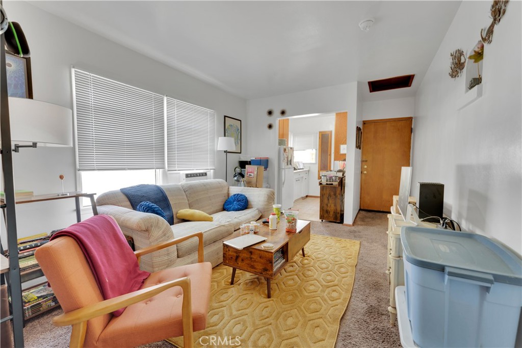 32 North 1st Street, Unit A Alhambra, CA 91801 - Photo 2 of 6 a living room with furniture and a flat screen tv